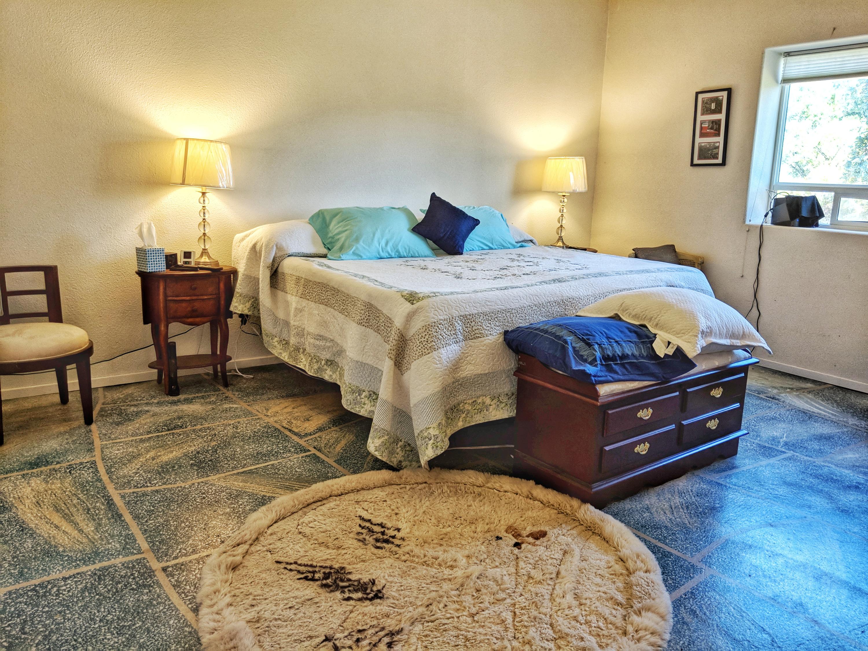 6818 Rector Creek Road Igo, CA 96047 - Photo 12 of 34 a bedroom with a bed and wooden floor