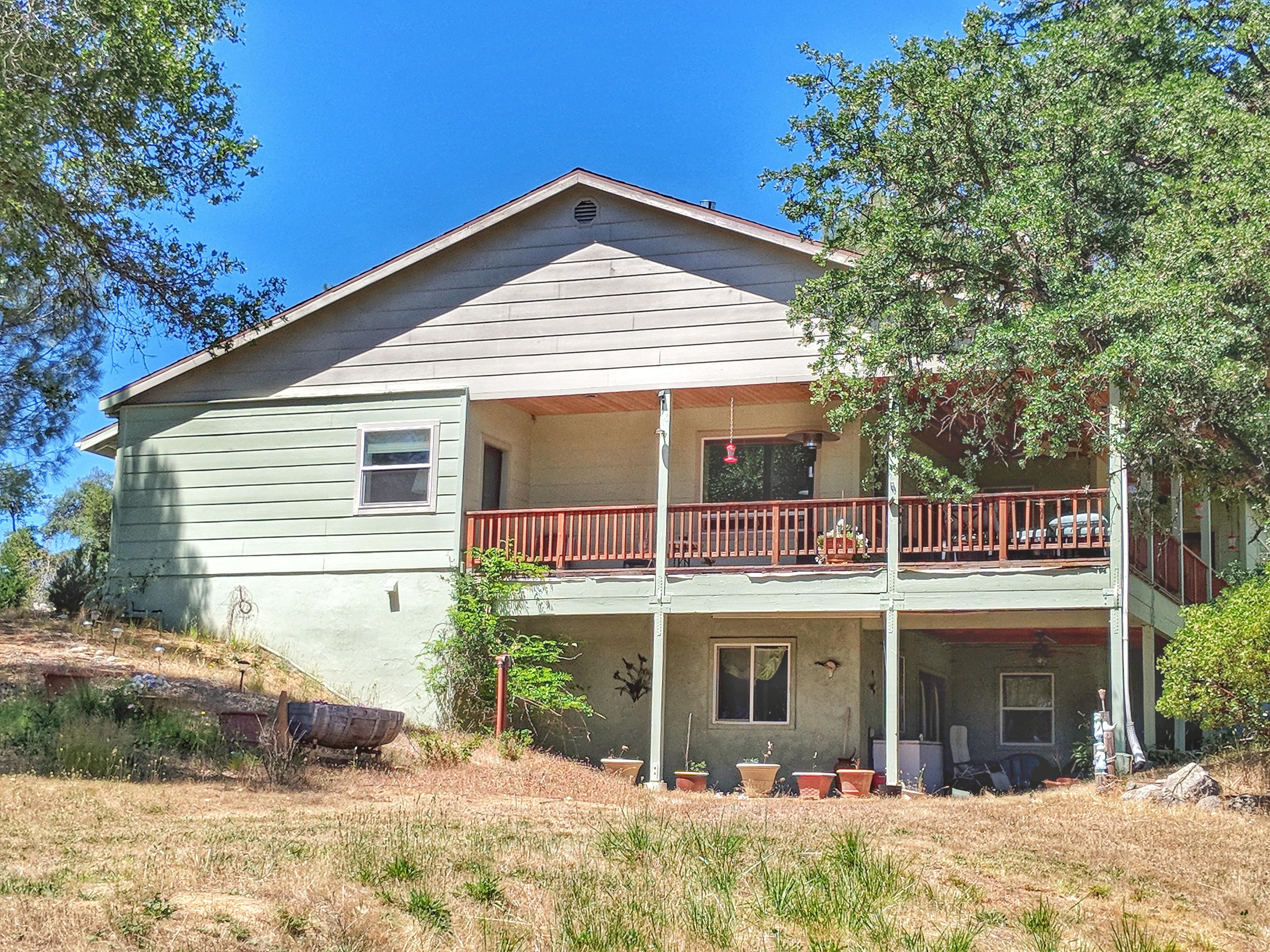 6818 Rector Creek Road Igo, CA 96047 - Photo 24 of 34 a front view of a house with a yard