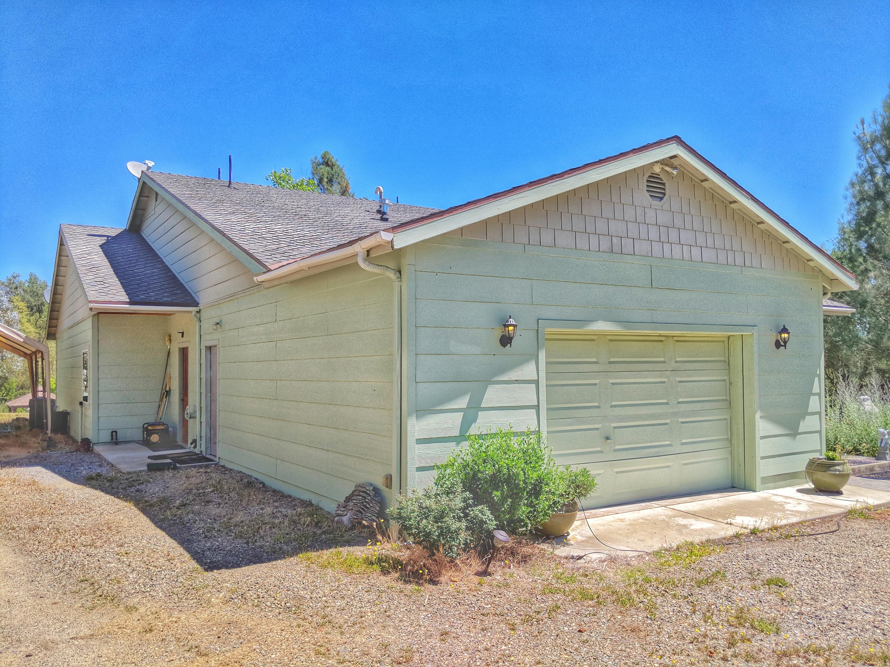 6818 Rector Creek Road Igo, CA 96047 - Photo 26 of 34 a view of a house wooden small yard and garage