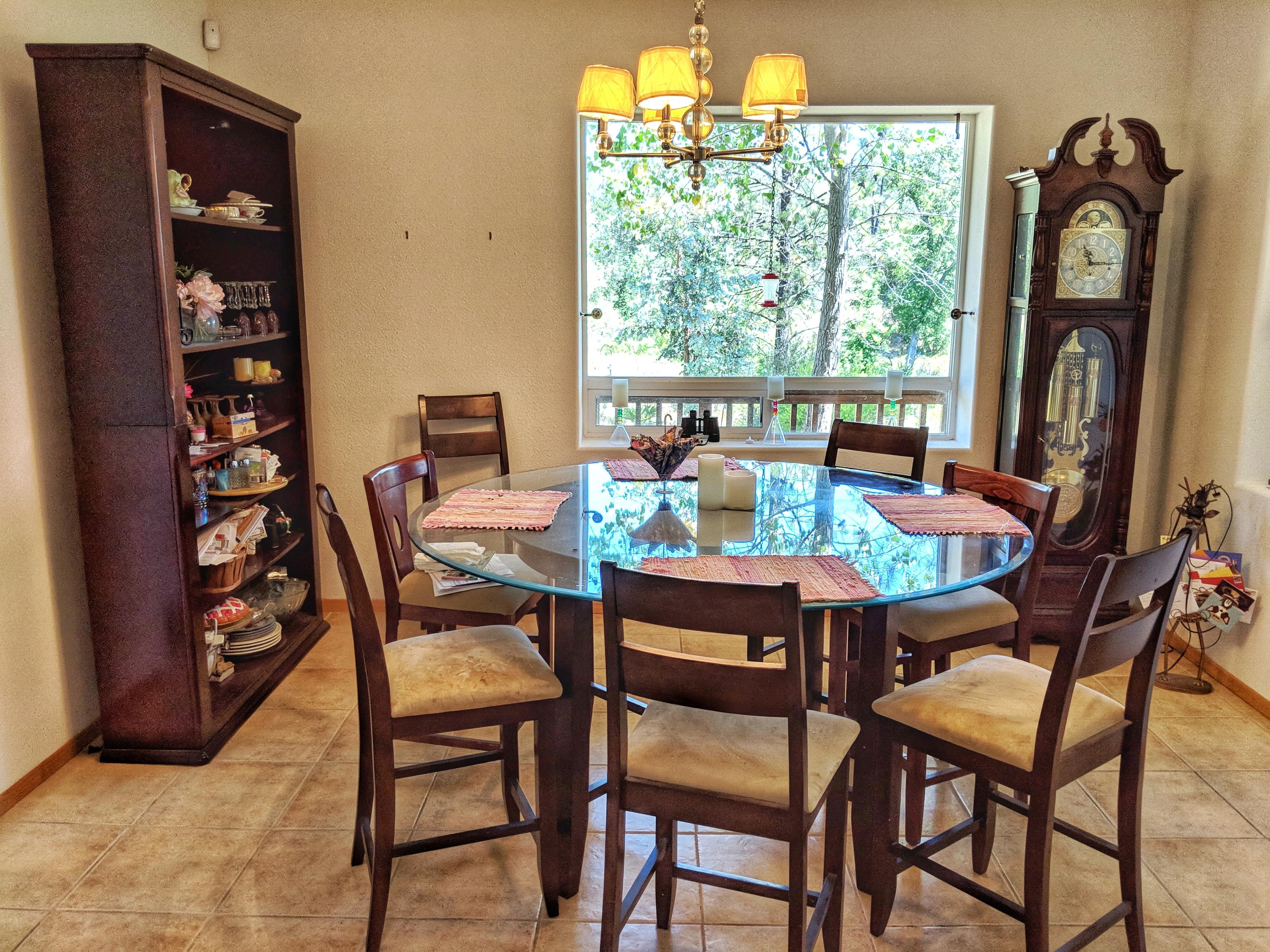 6818 Rector Creek Road Igo, CA 96047 - Photo 10 of 34 a dining room with furniture and a floor to ceiling window