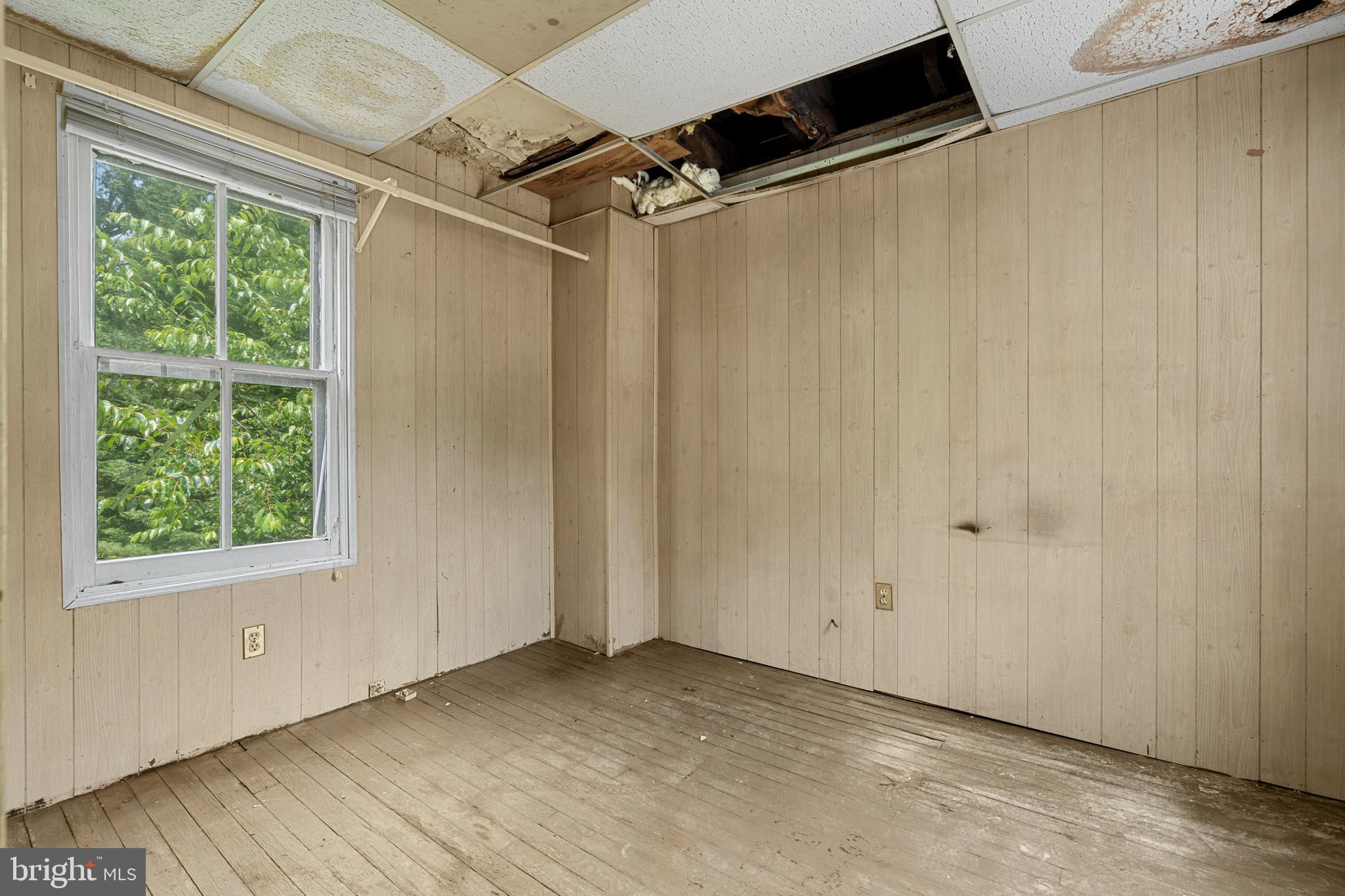 527 Berwyn Baptist Road Devon, PA 19333 - Photo 11 of 20 a view of empty room with wooden floor and windows