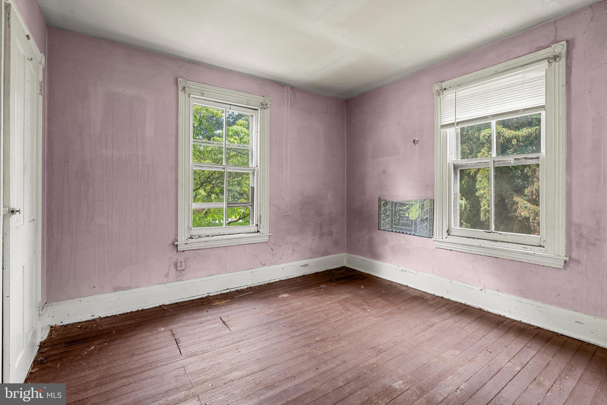 527 Berwyn Baptist Road Devon, PA 19333 - Photo 12 of 20 a view of an empty room with wooden floor and a window