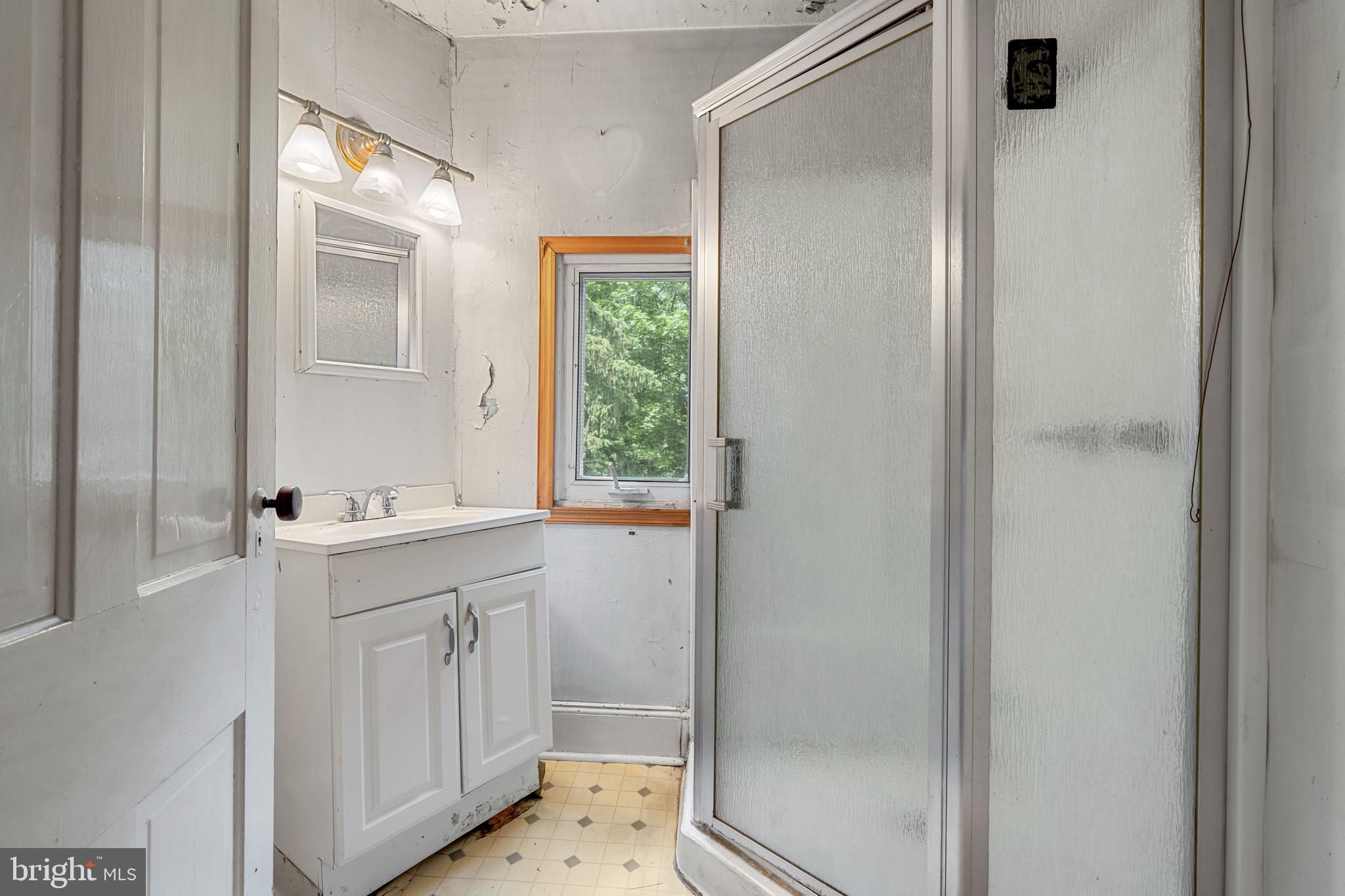 527 Berwyn Baptist Road Devon, PA 19333 - Photo 16 of 20 a bathroom with a sink and a mirror