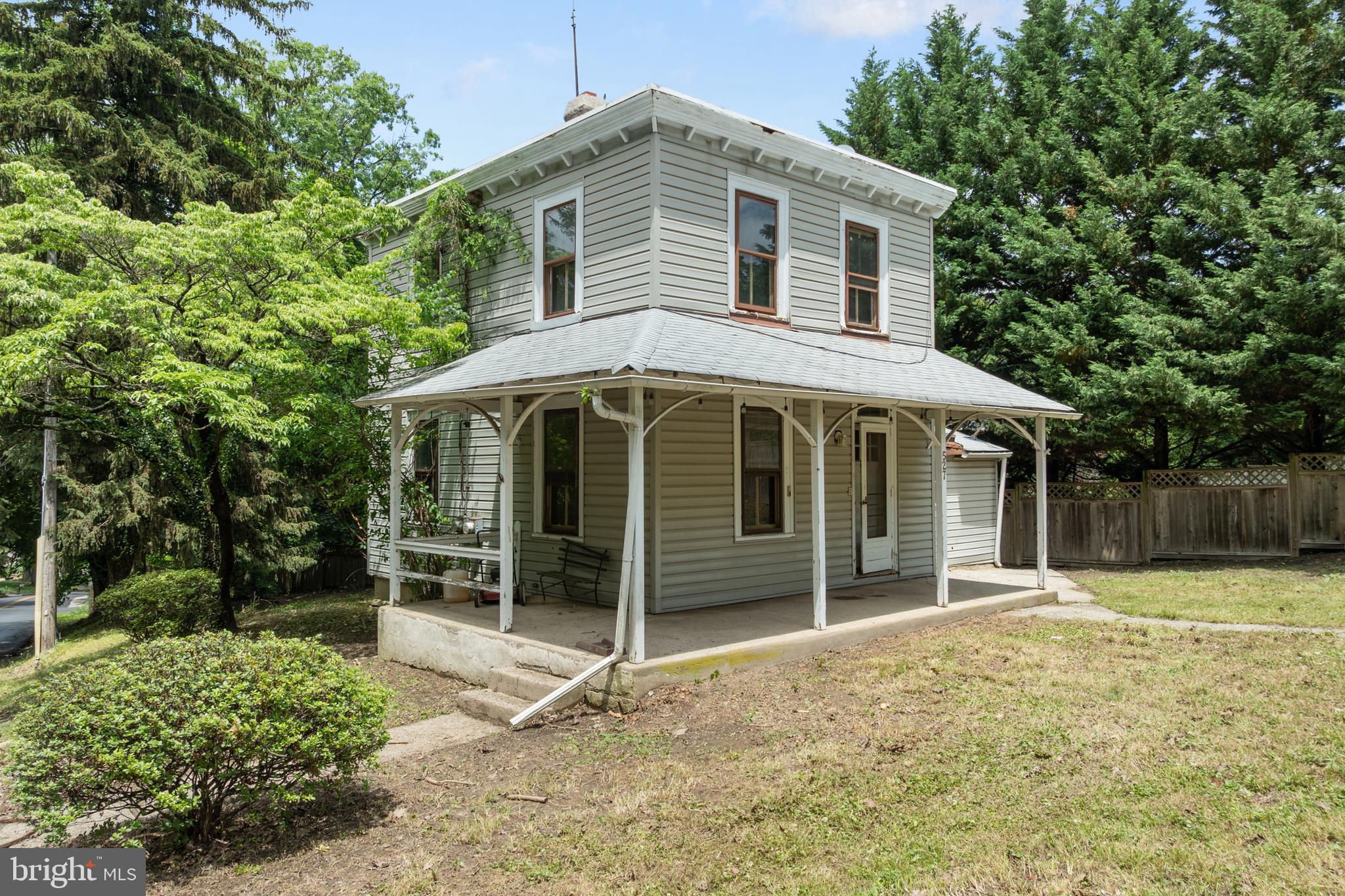 527 Berwyn Baptist Road Devon, PA 19333 - Photo 2 of 20 a front view of a house with a yard and garage