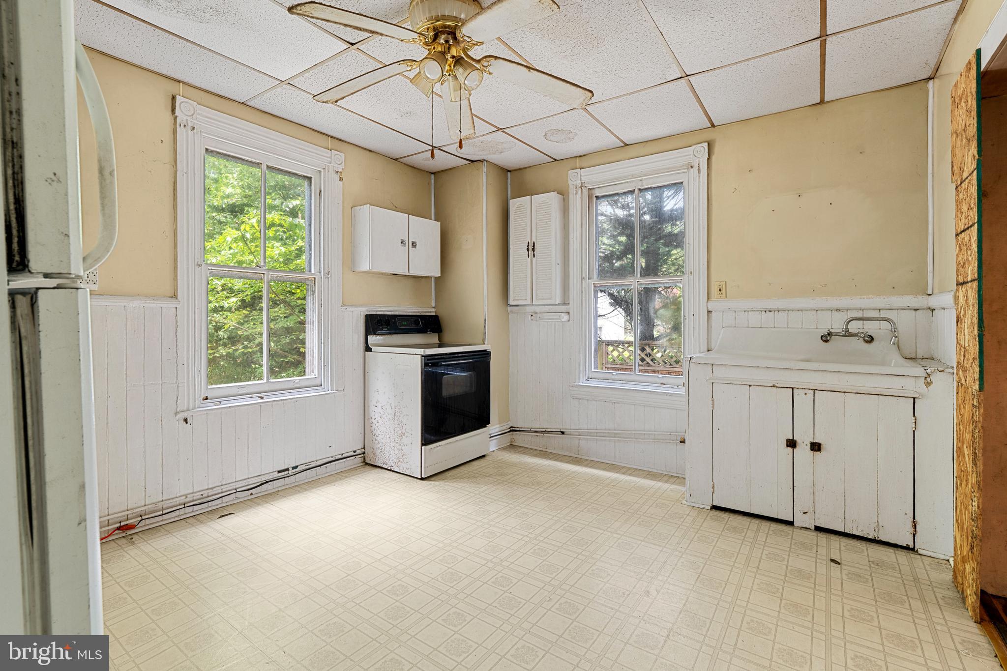 527 Berwyn Baptist Road Devon, PA 19333 - Photo 8 of 20 a view of a kitchen with a sink and dishwasher a kitchen island with a large window