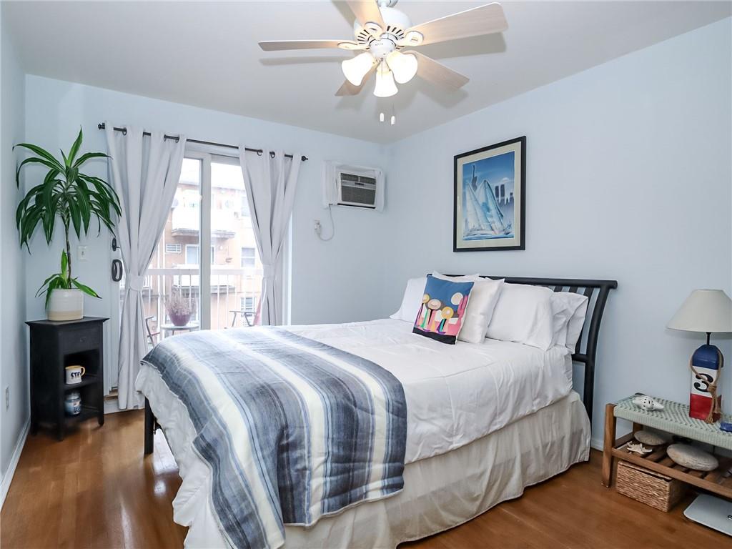 2312 Stuart Street, Unit 2L Brooklyn, NY 11229 - Photo 11 of 24 a bedroom with bed and a chandelier