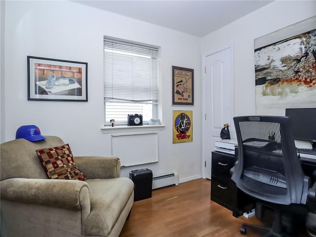 2312 Stuart Street, Unit 2L Brooklyn, NY 11229 - Photo 15 of 24 a living room with furniture and painting on the wall