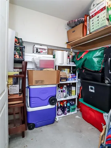 a room with storage and a flat screen tv