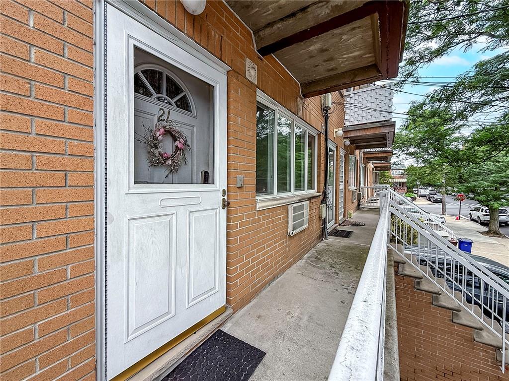 2312 Stuart Street, Unit 2L Brooklyn, NY 11229 - Photo 3 of 24 a front view of a house with a porch