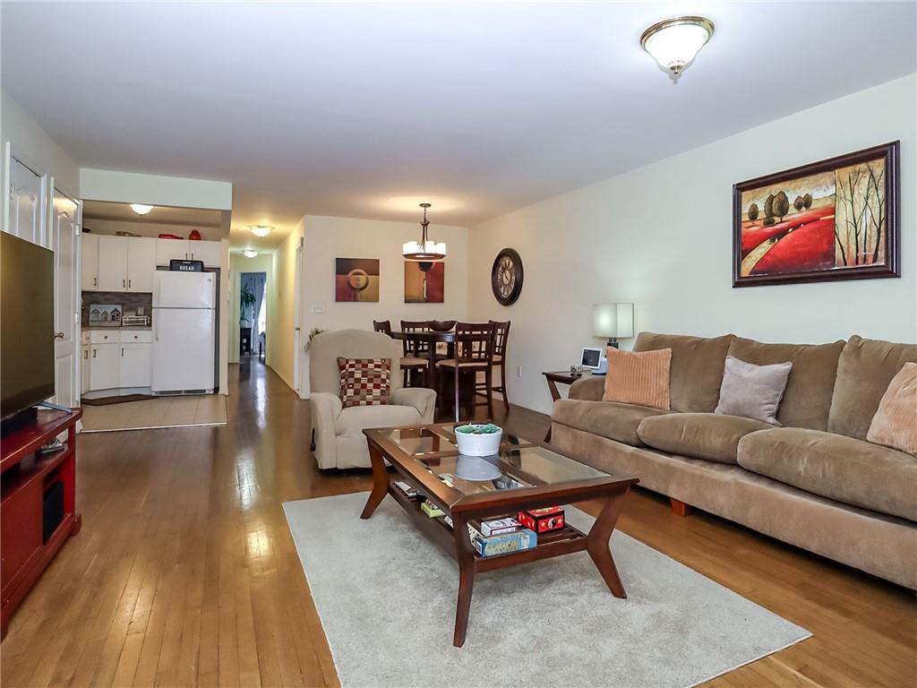 2312 Stuart Street, Unit 2L Brooklyn, NY 11229 - Photo 6 of 24 a living room with furniture and a flat screen tv