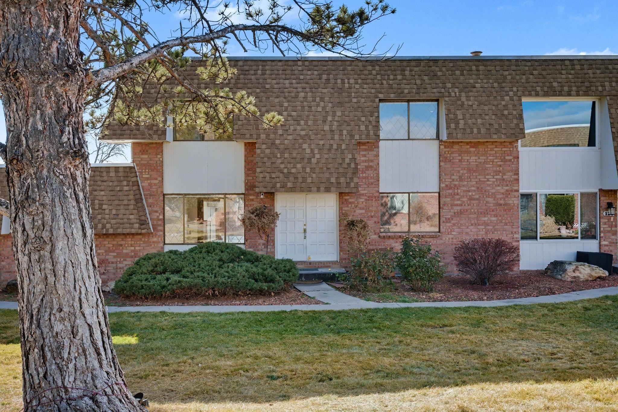 2700 G Road, Unit 12F Grand Junction, CO 81506 - Photo 2 of 24 a front view of a house with garden