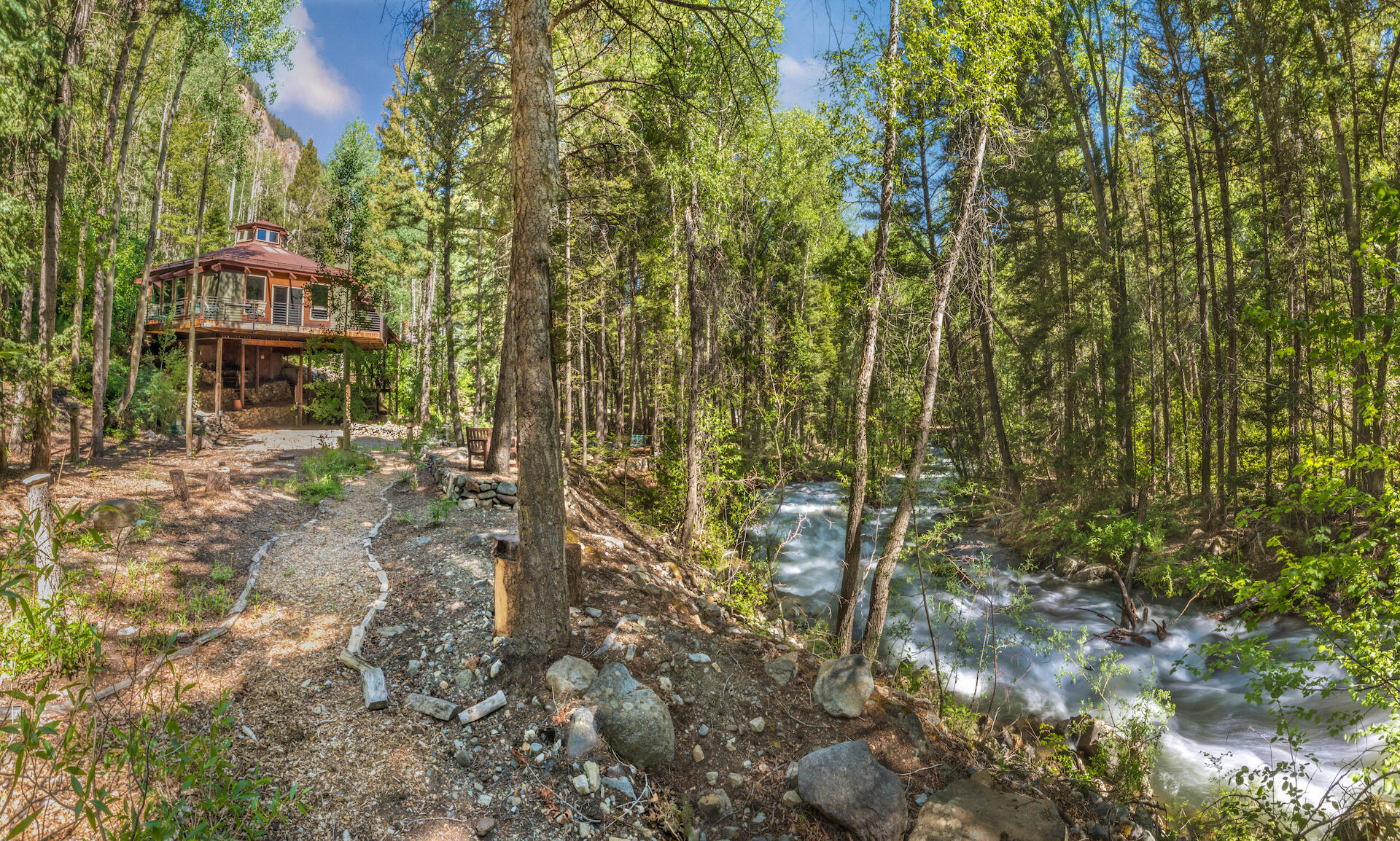 a view of a house with a tree