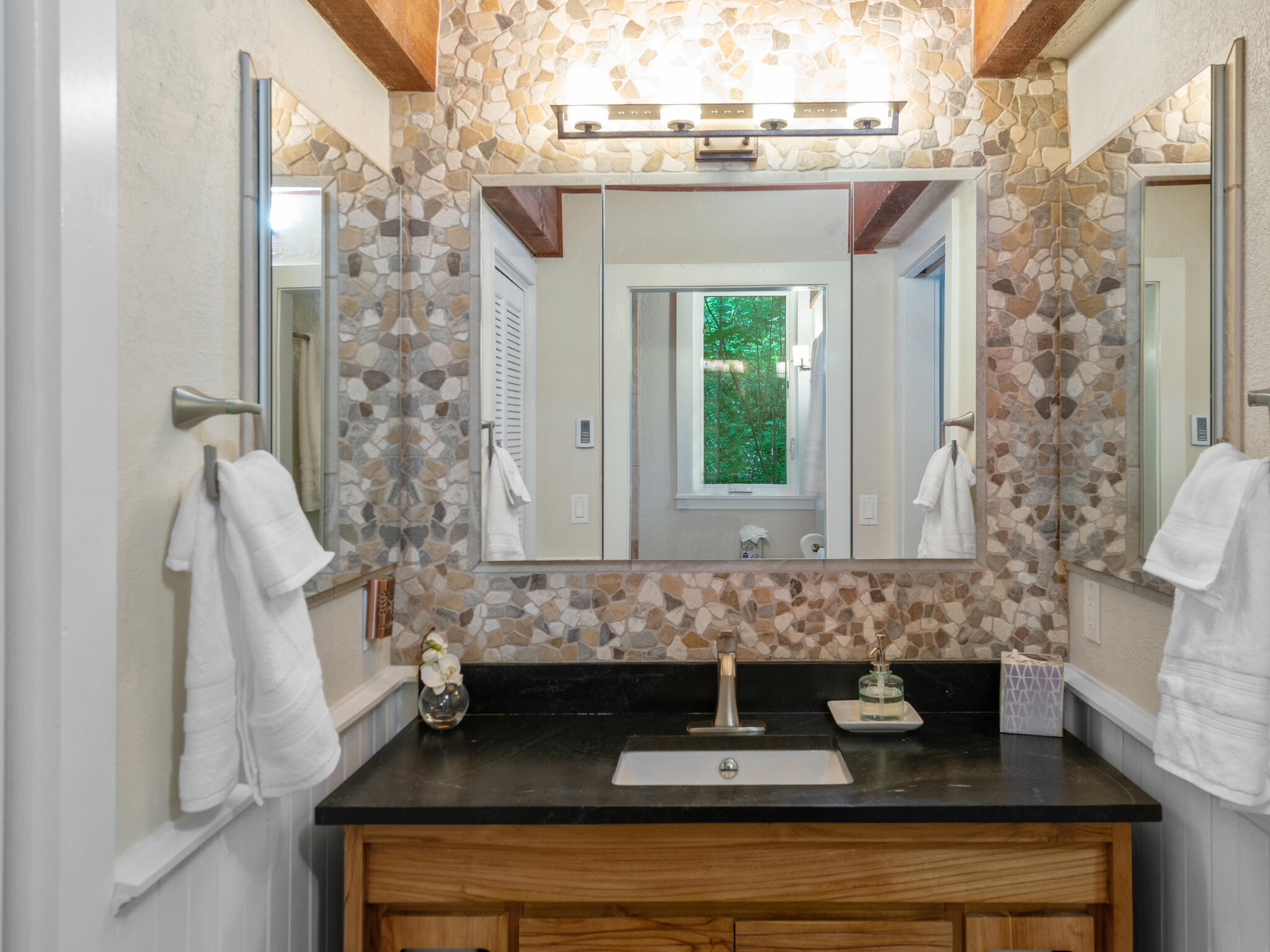 226 Lake Fork Junction Road Ophir, CO 81426 - Photo 17 of 31 a bathroom with a granite countertop sink a mirror and shower