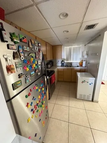 a living room with lots of furniture and a chandelier