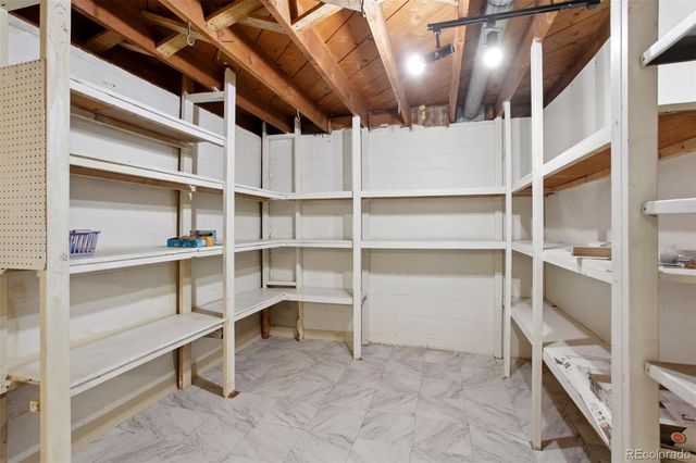 a view of an empty room with racks on the wall