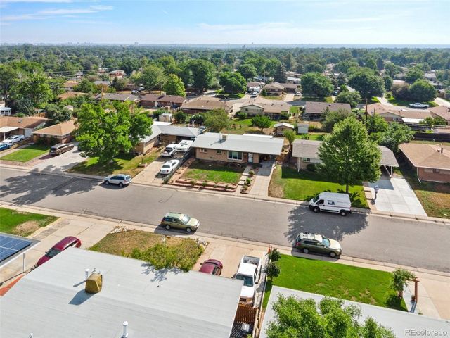 an aerial view of a house with yard swimming pool and outdoor seating