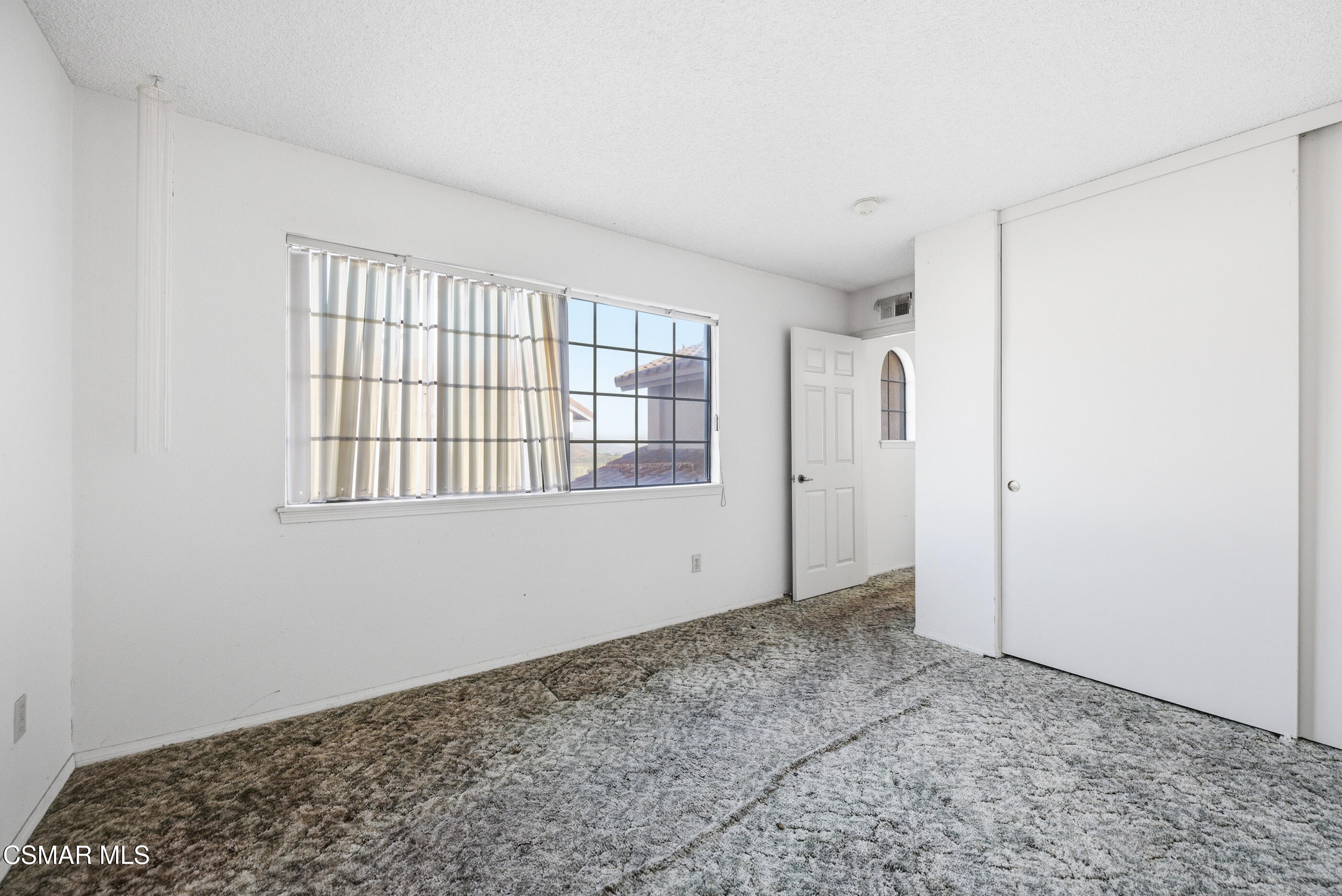 12036 Shadow Ridge Way Porter Ranch, CA 91326 - Photo 29 of 35 a view of an empty room with window