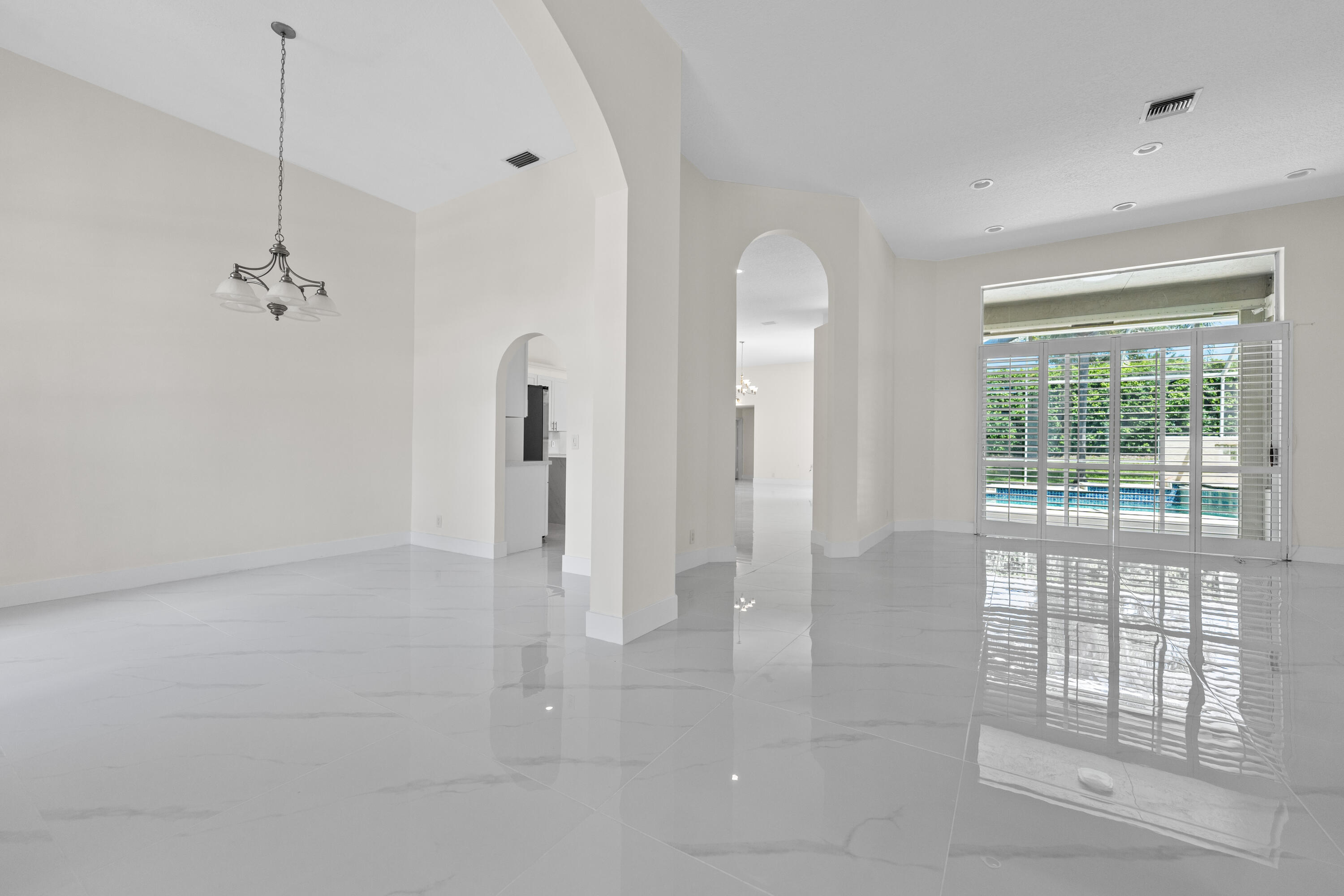 10648 Maple Chase Drive Boca Raton, FL 33498 - Photo 12 of 52 a view of a room with large windows