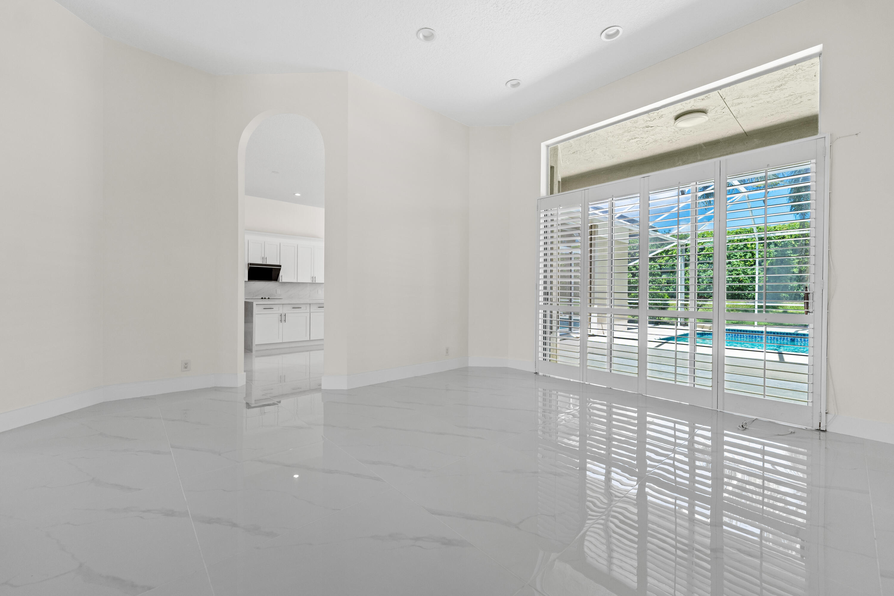 10648 Maple Chase Drive Boca Raton, FL 33498 - Photo 14 of 52 a view of empty room with wooden floor and fan
