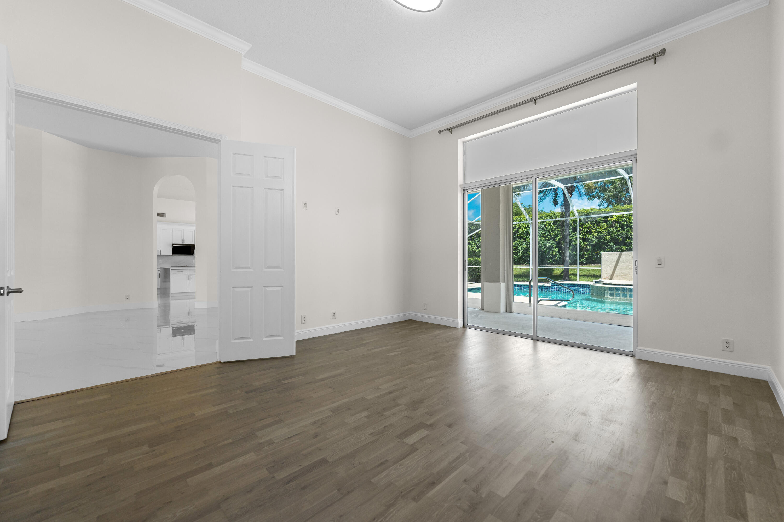 10648 Maple Chase Drive Boca Raton, FL 33498 - Photo 18 of 52 a view of empty room with wooden floor and fan