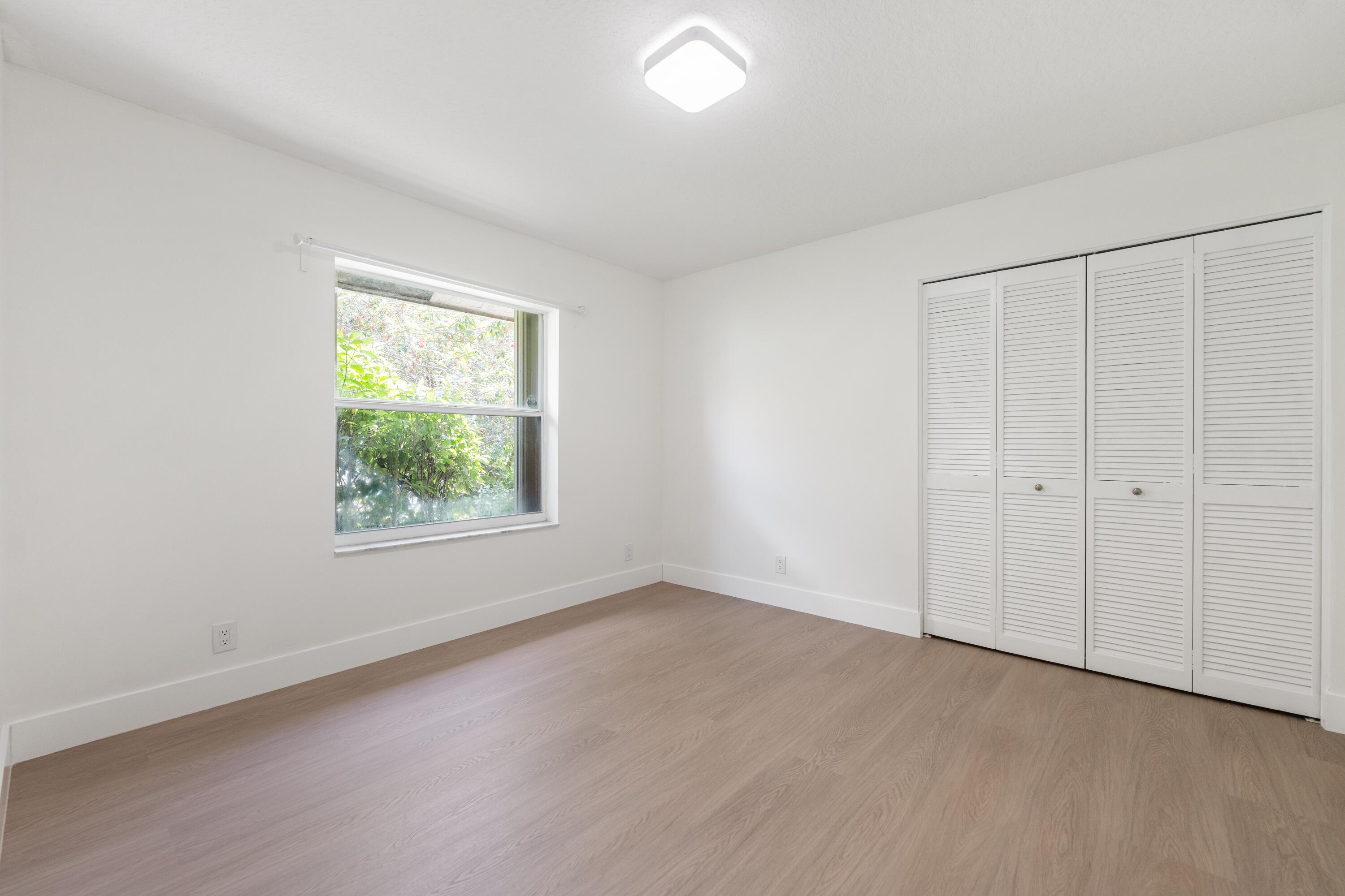 10648 Maple Chase Drive Boca Raton, FL 33498 - Photo 21 of 52 an empty room with a window