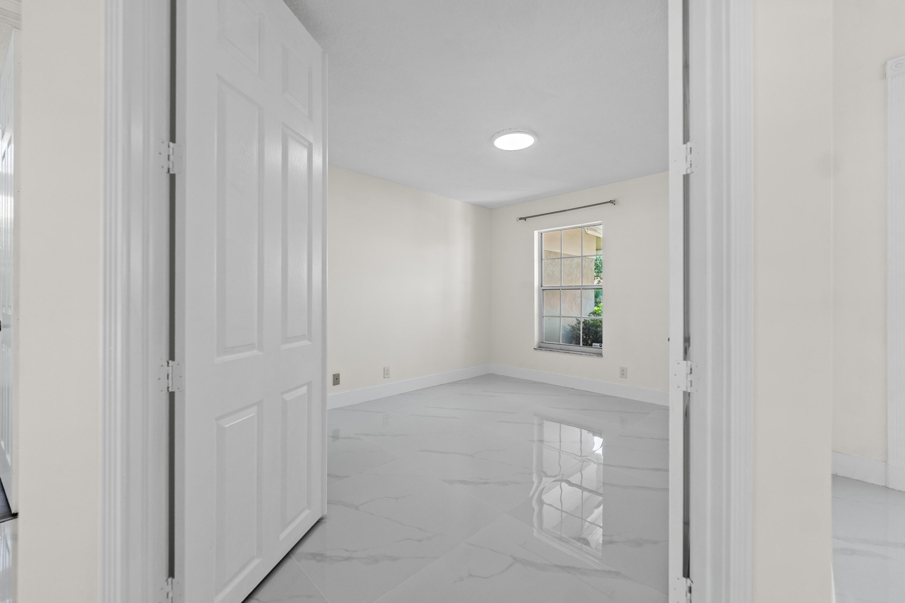 10648 Maple Chase Drive Boca Raton, FL 33498 - Photo 27 of 52 a view of an empty room with window and closet area