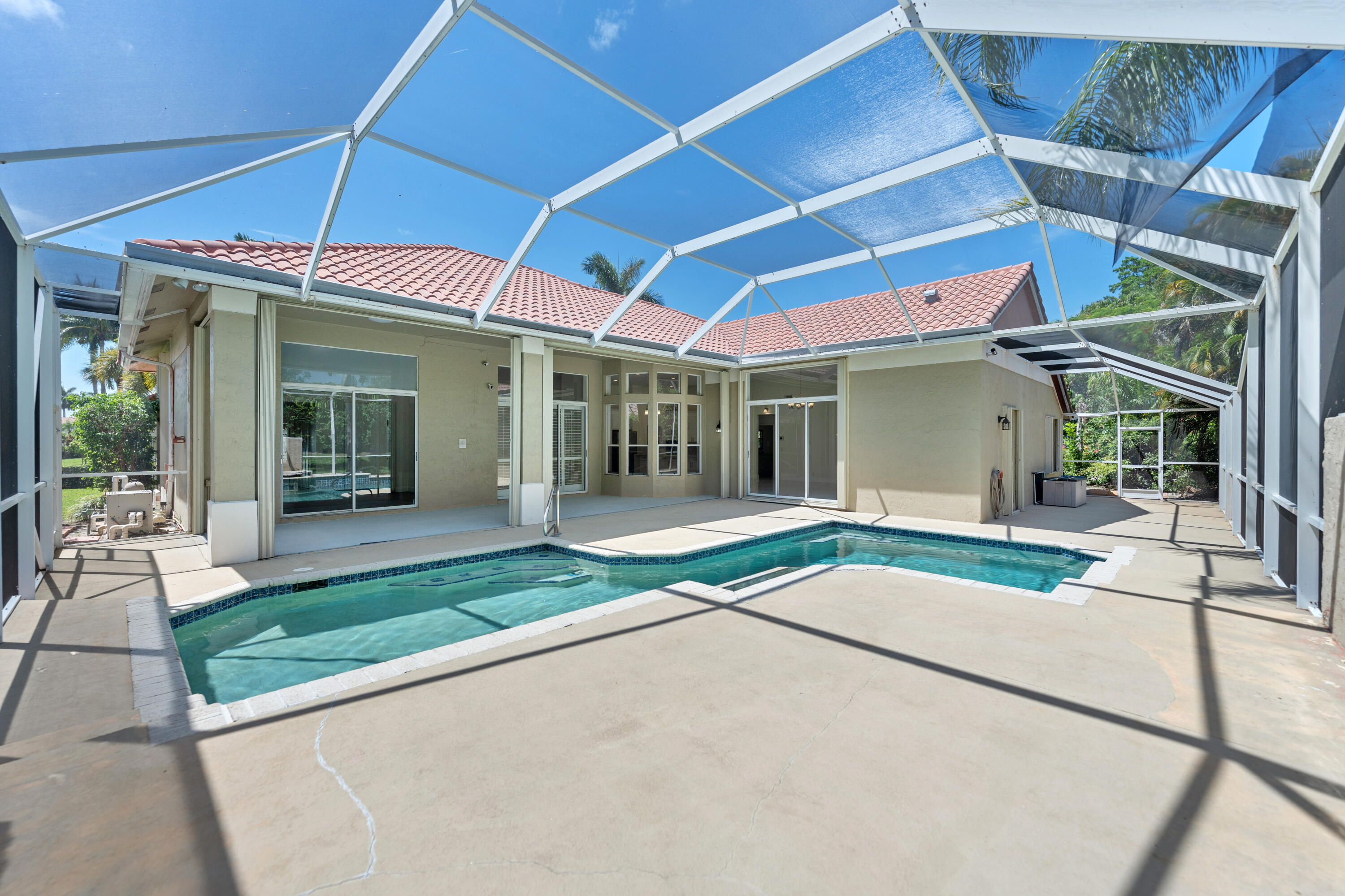 10648 Maple Chase Drive Boca Raton, FL 33498 - Photo 33 of 52 a house view with a outdoor space