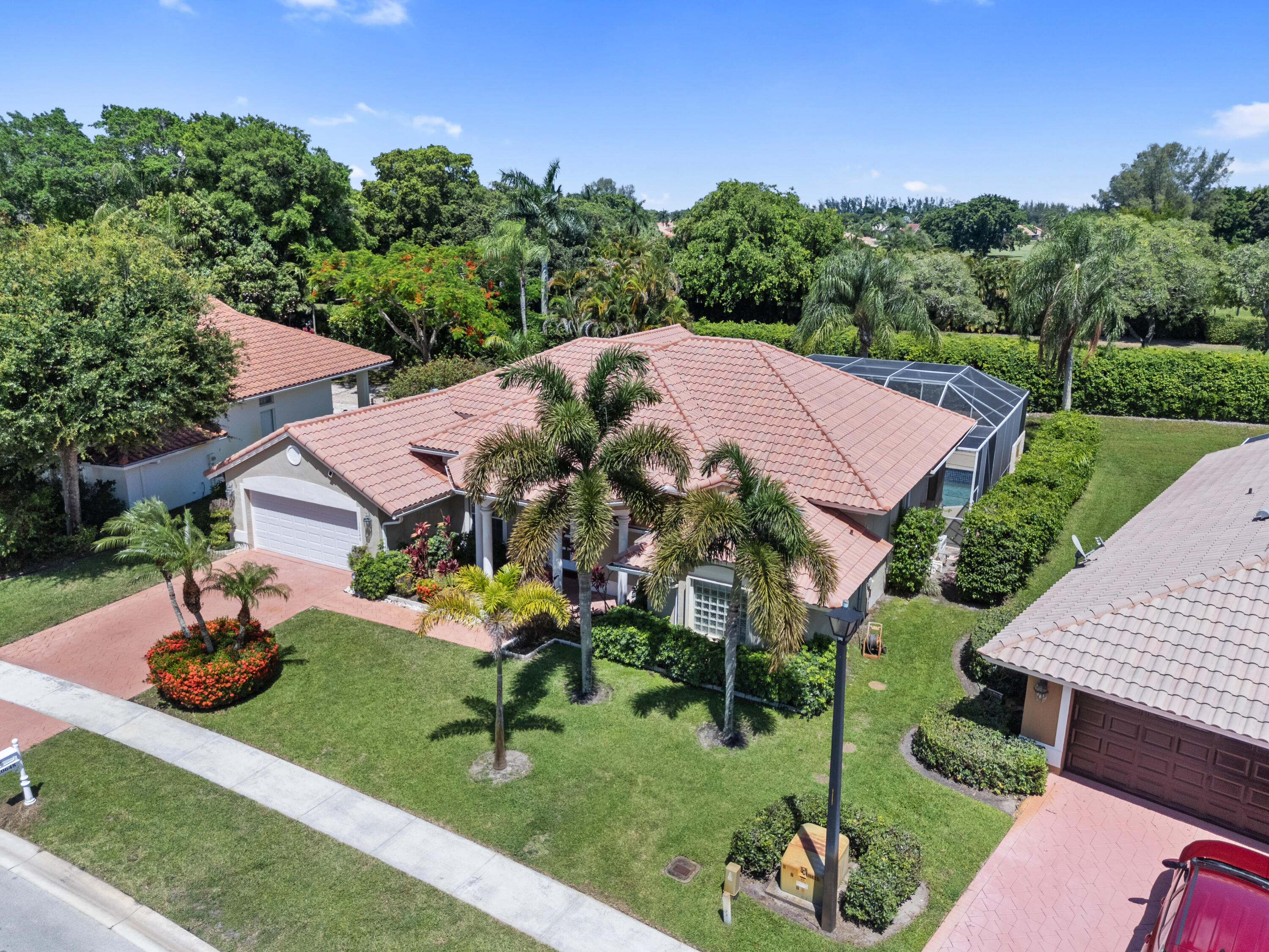 10648 Maple Chase Drive Boca Raton, FL 33498 - Photo 40 of 52 an aerial view of a house with garden space and street view