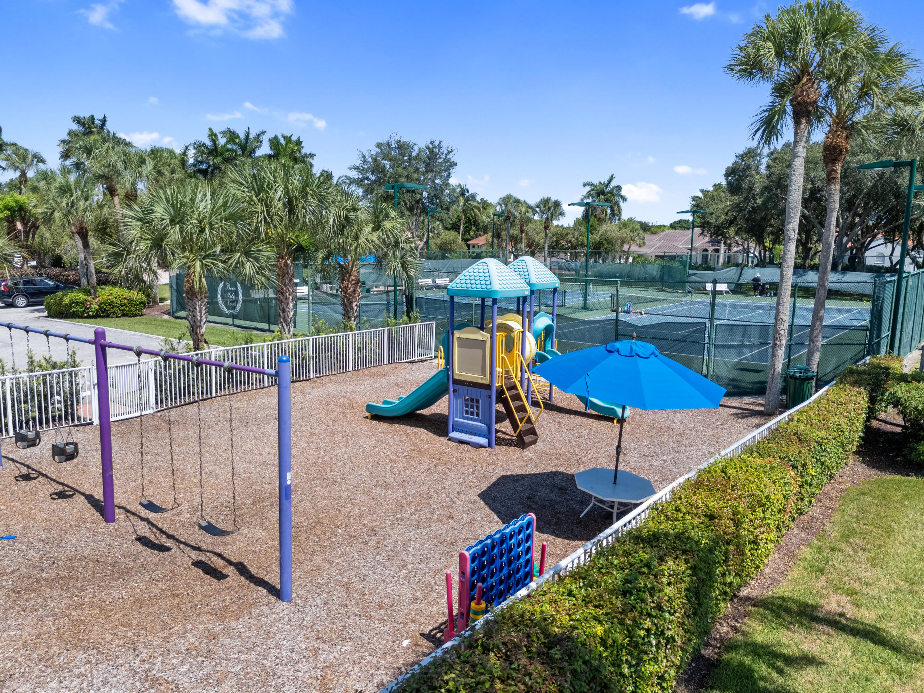 10648 Maple Chase Drive Boca Raton, FL 33498 - Photo 48 of 52 a view of a park with iron fence