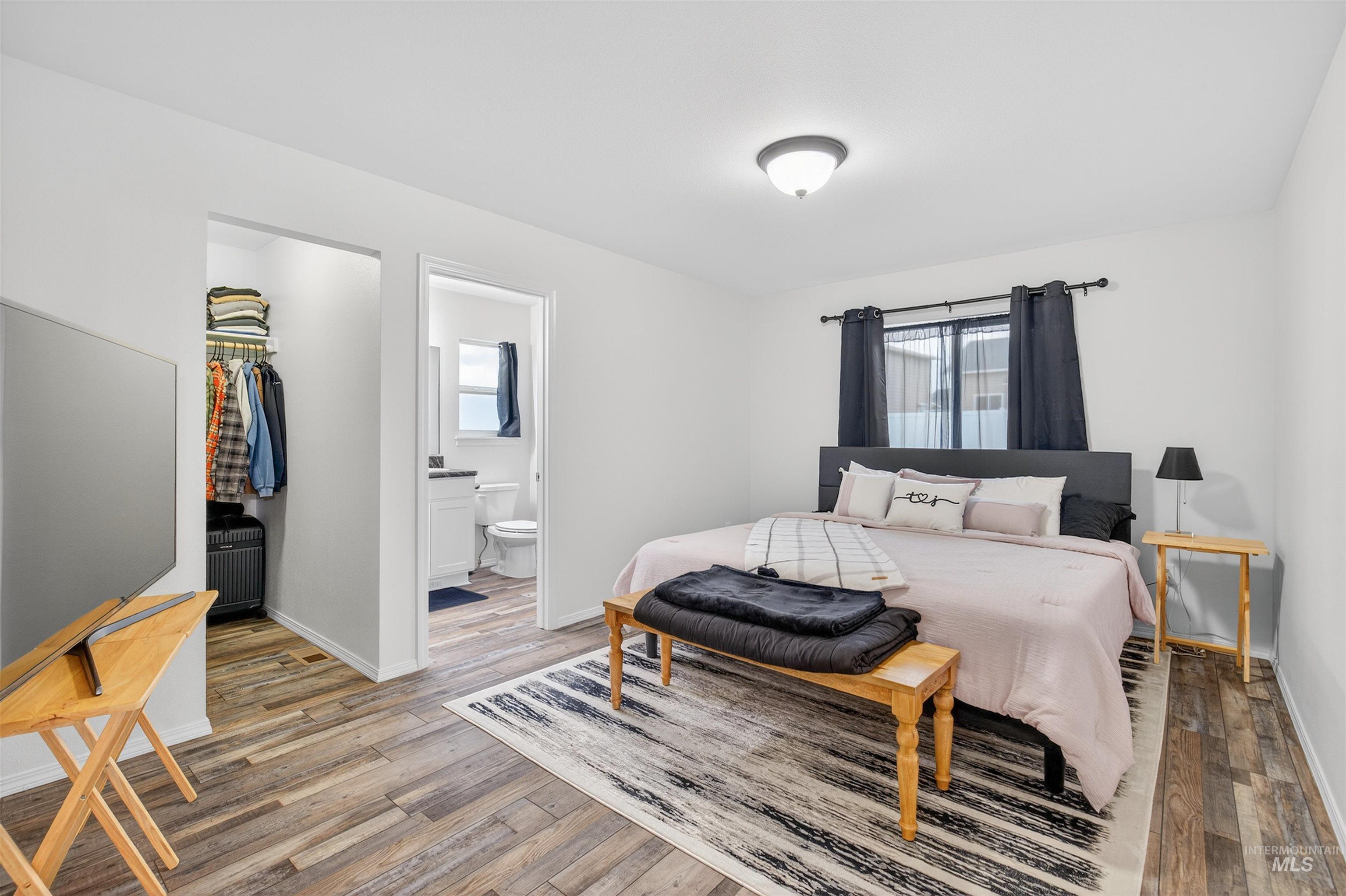 1432 Horizon Court Lewiston, ID 83501 - Photo 15 of 26 Bedroom featuring a spacious closet and wood finished floors