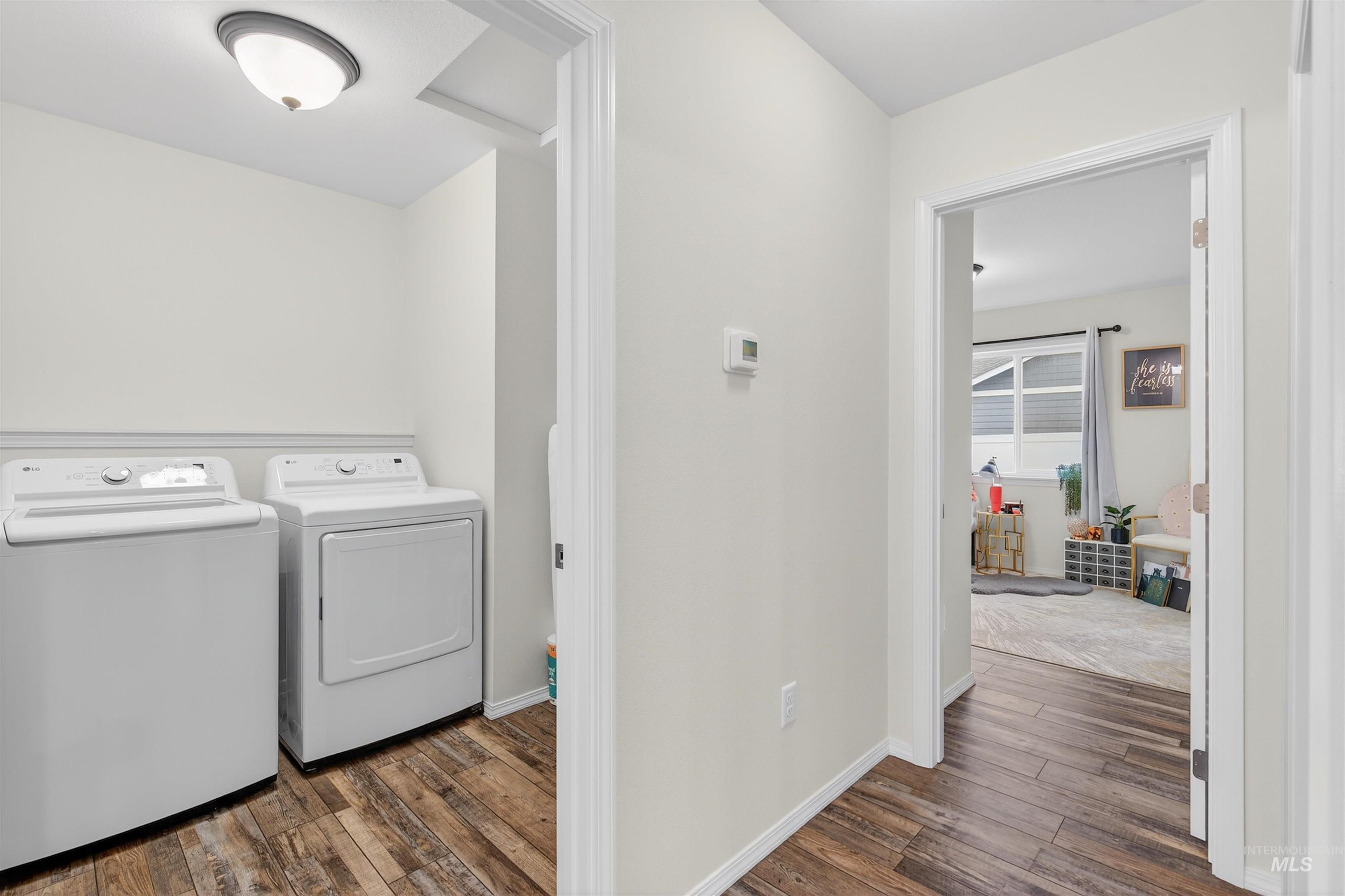 1432 Horizon Court Lewiston, ID 83501 - Photo 23 of 26 Washroom with dark wood-style flooring and washer and clothes dryer