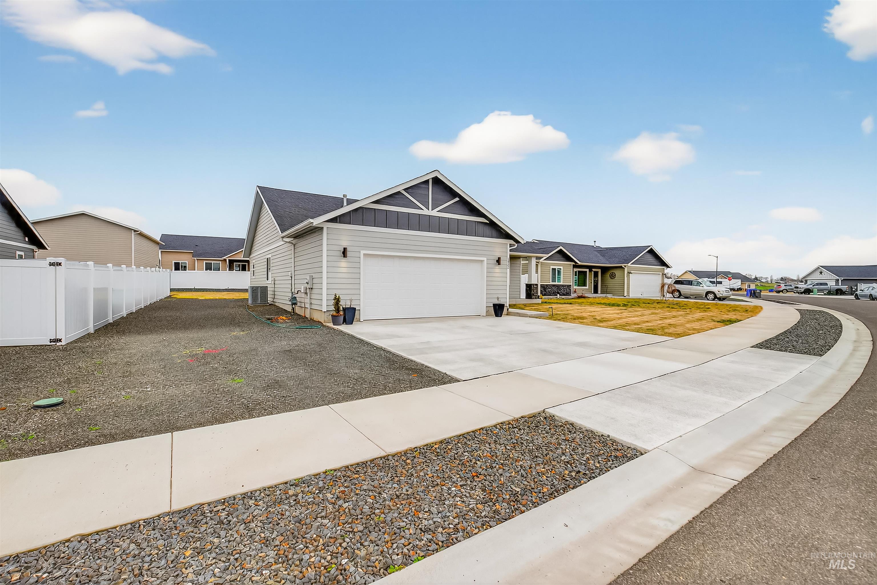 1432 Horizon Court Lewiston, ID 83501 - Photo 3 of 26 View of front of home with board and batten siding, driveway, and a residential view