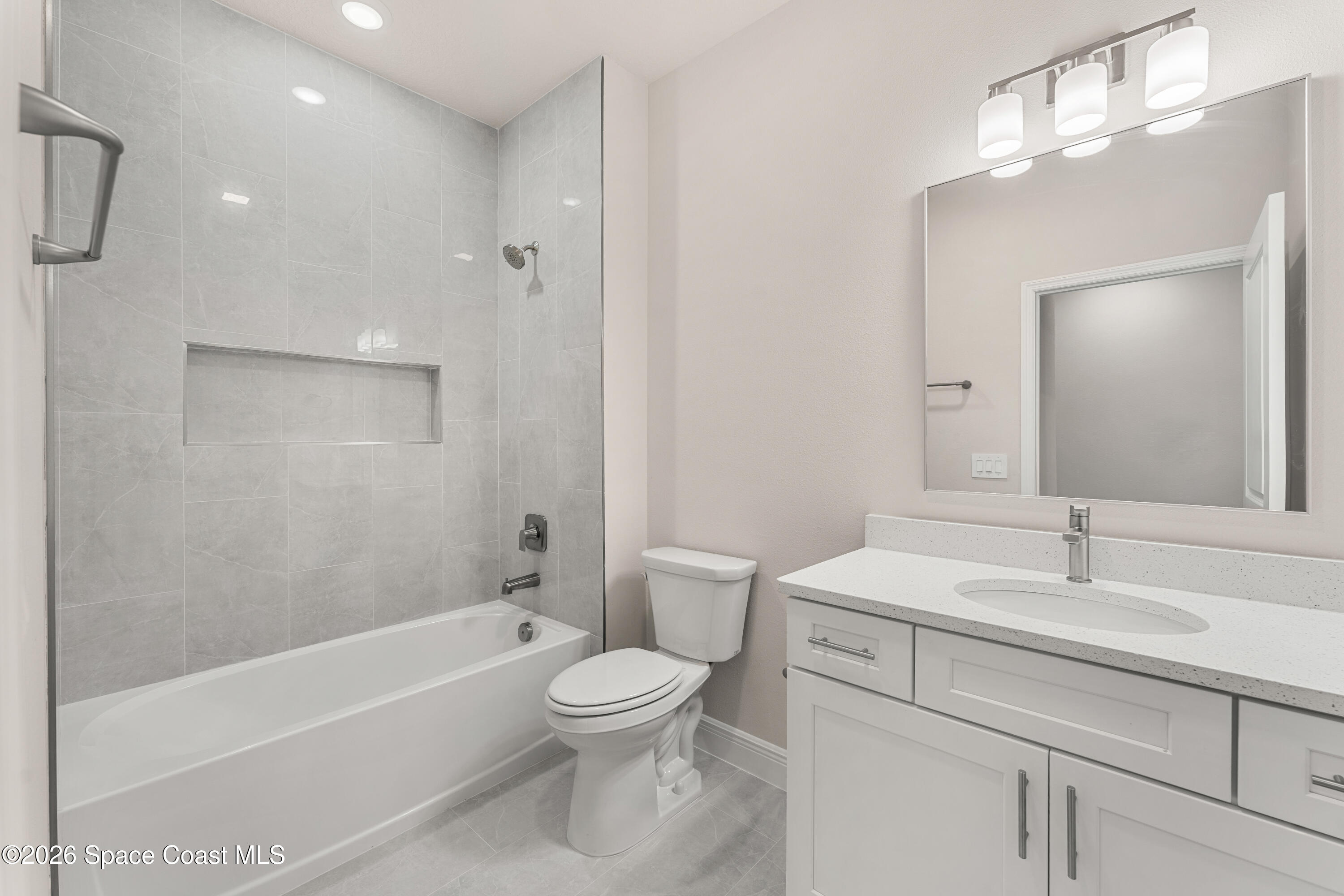 455 Mimosa Street Southwest Palm Bay, FL 32908 - Photo 16 of 43 a bathroom with a sink a toilet and shower