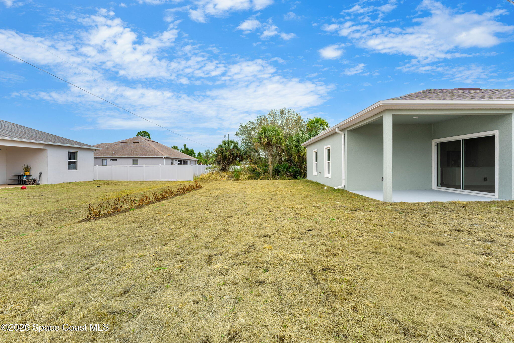 455 Mimosa Street Southwest Palm Bay, FL 32908 - Photo 20 of 43 a view of a house with a backyard
