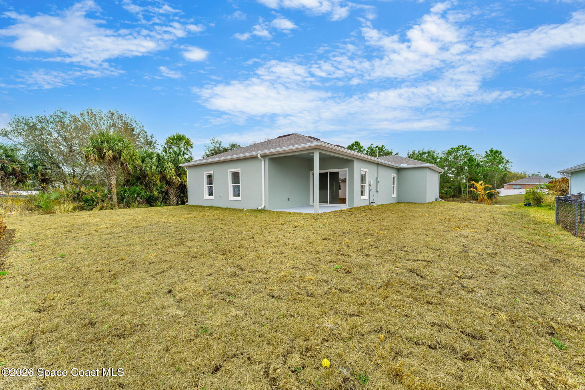 455 Mimosa Street Southwest Palm Bay, FL 32908 - Photo 21 of 43 a view of house with backyard