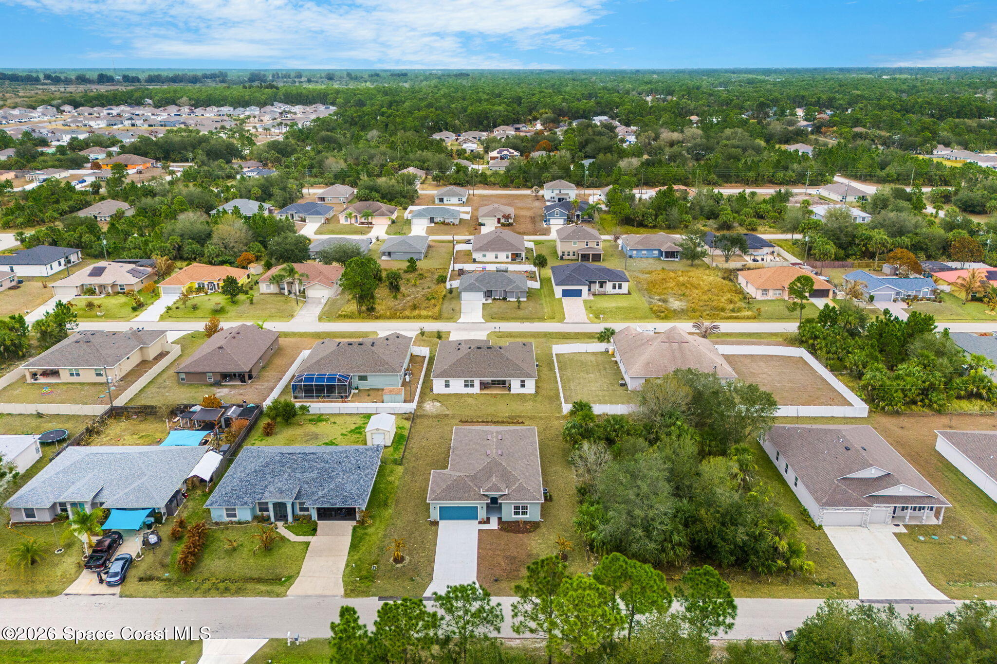 455 Mimosa Street Southwest Palm Bay, FL 32908 - Photo 27 of 43 an aerial view of residential houses with outdoor space