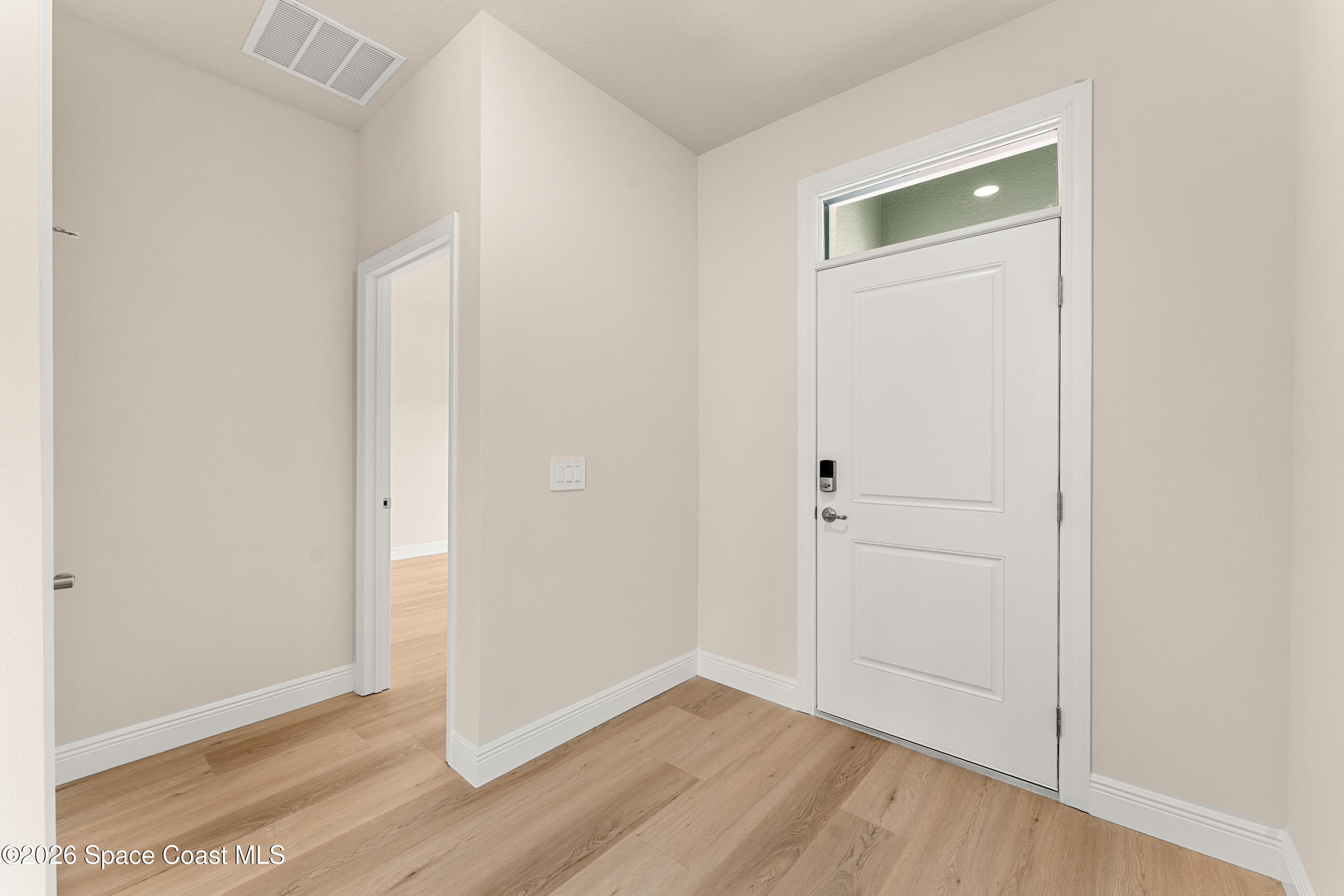 455 Mimosa Street Southwest Palm Bay, FL 32908 - Photo 3 of 43 a view of small space with wooden floor