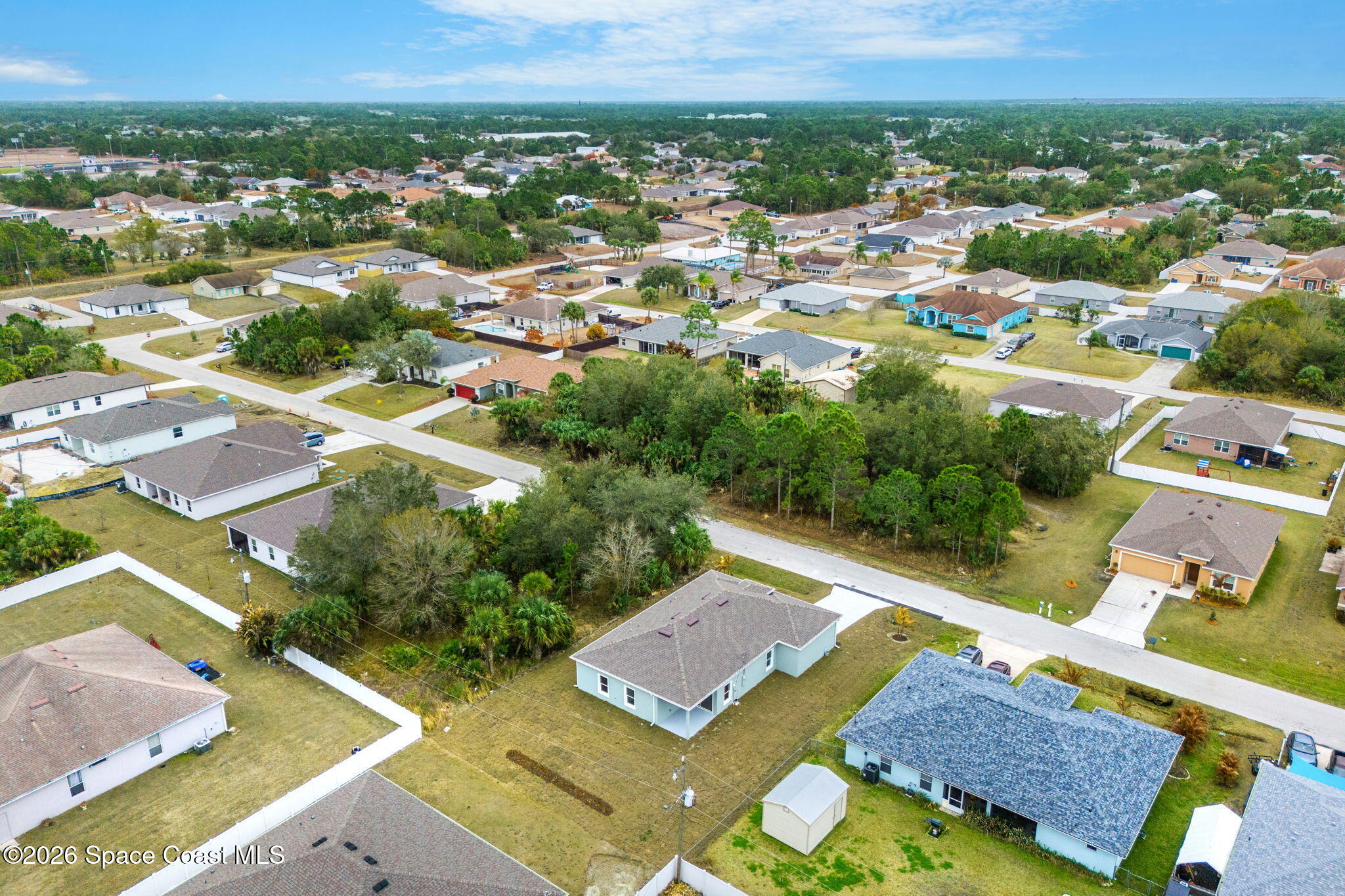 455 Mimosa Street Southwest Palm Bay, FL 32908 - Photo 31 of 43 an aerial view of residential houses with outdoor space and city view