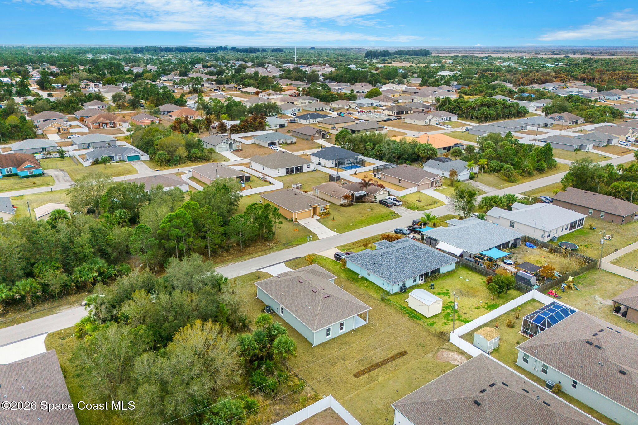 455 Mimosa Street Southwest Palm Bay, FL 32908 - Photo 33 of 43 an aerial view of residential houses with outdoor space and parking