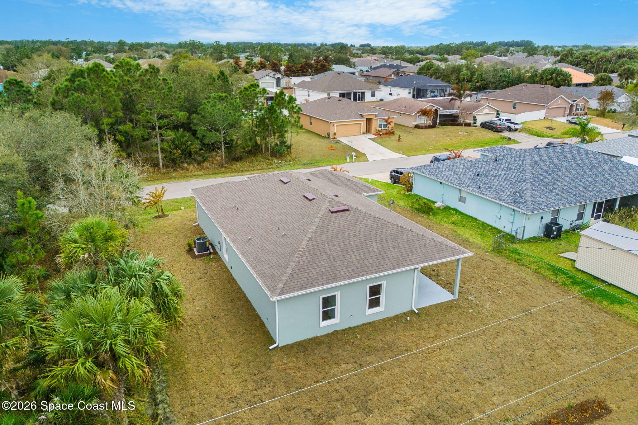 455 Mimosa Street Southwest Palm Bay, FL 32908 - Photo 34 of 43 an aerial view of residential houses with outdoor space and pool view