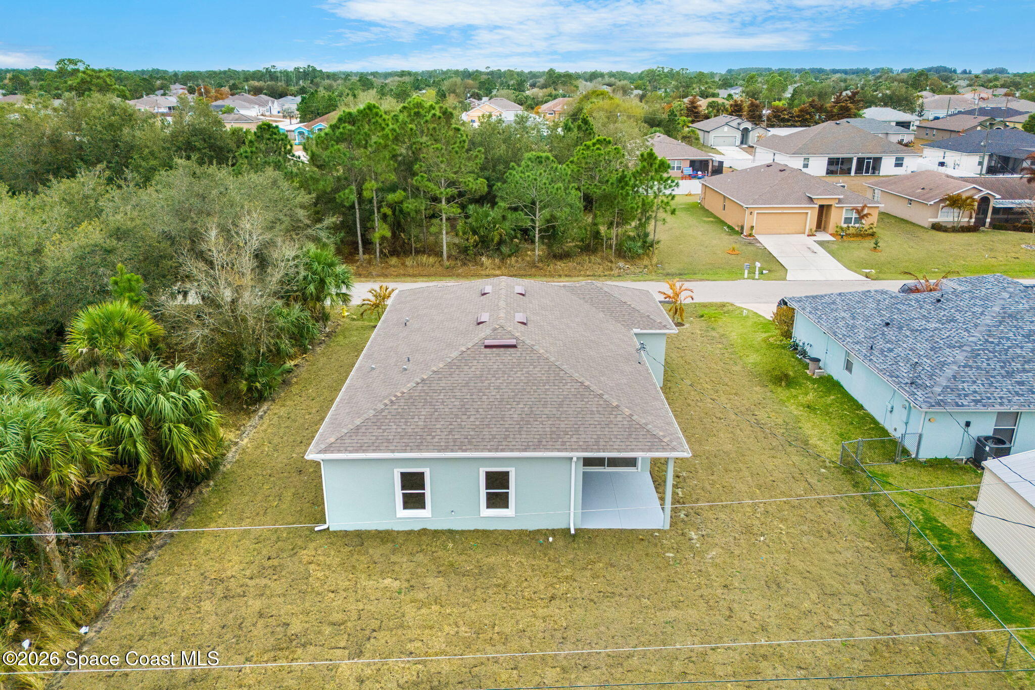 455 Mimosa Street Southwest Palm Bay, FL 32908 - Photo 35 of 43 an aerial view of a house with a yard