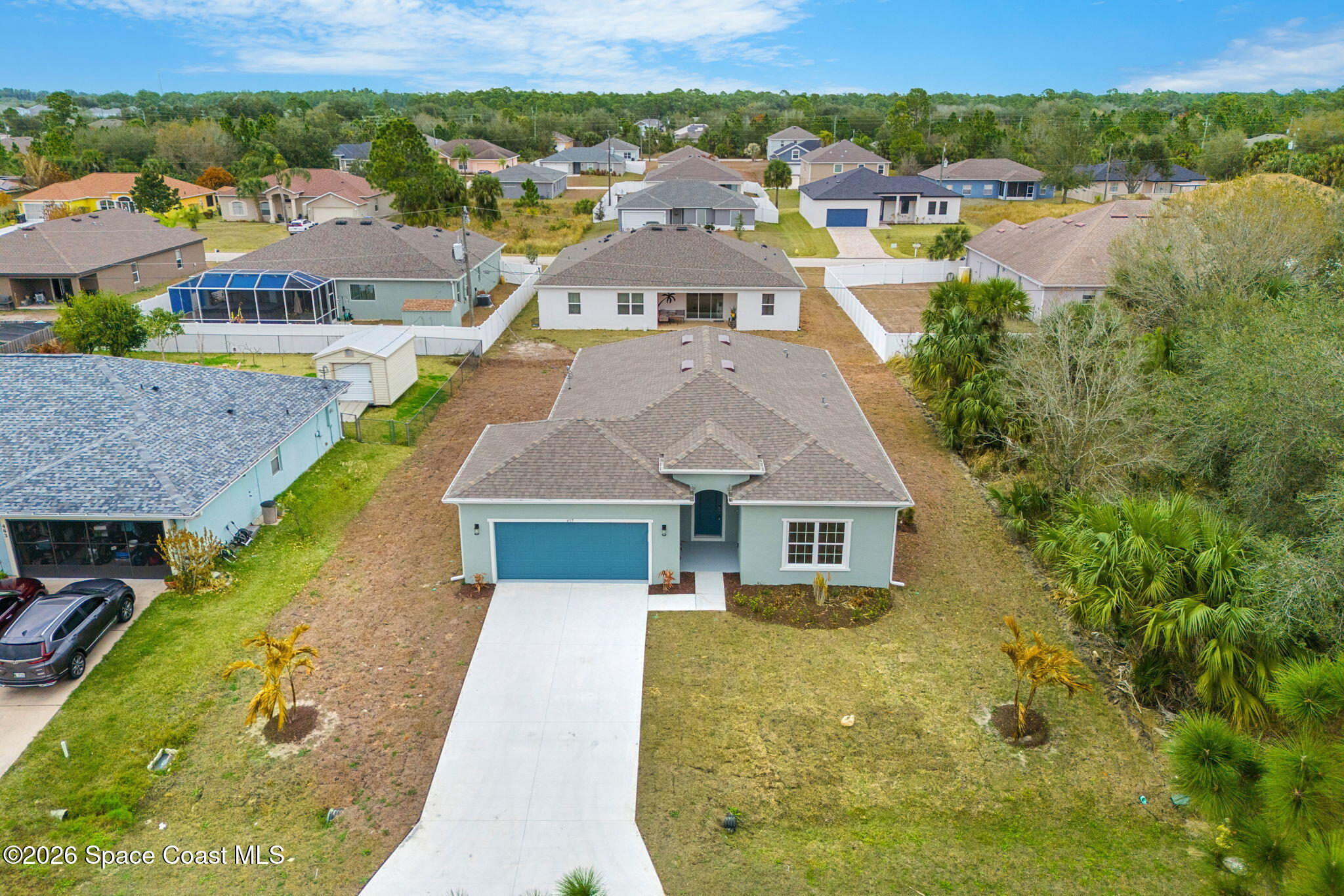 455 Mimosa Street Southwest Palm Bay, FL 32908 - Photo 38 of 43 an aerial view of residential houses with outdoor space and swimming pool