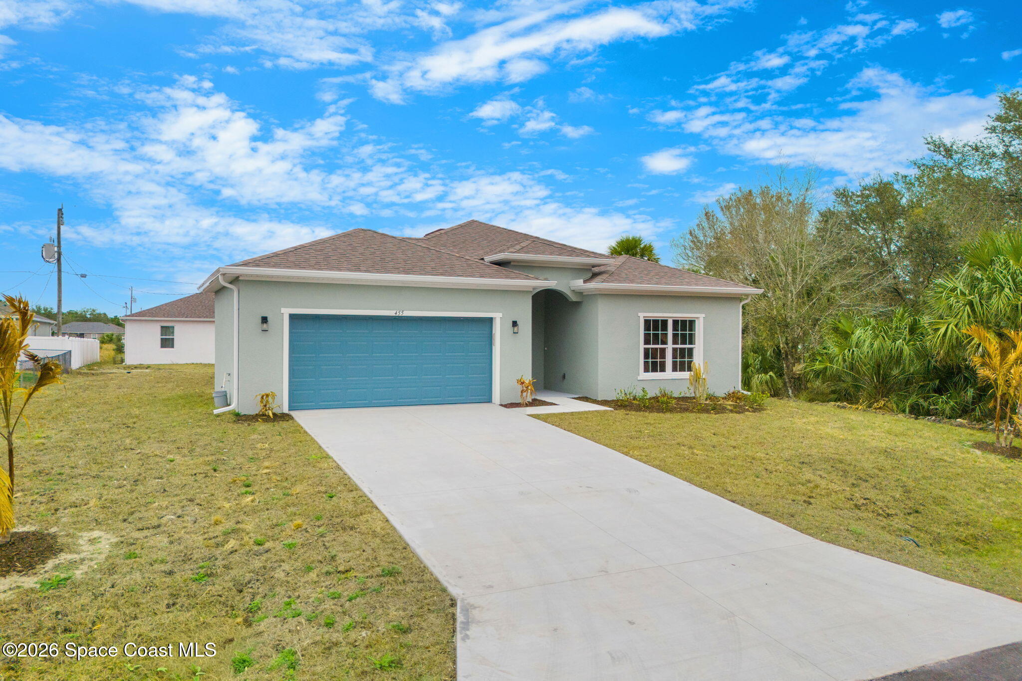 455 Mimosa Street Southwest Palm Bay, FL 32908 - Photo 41 of 43 a front view of a house with a garden
