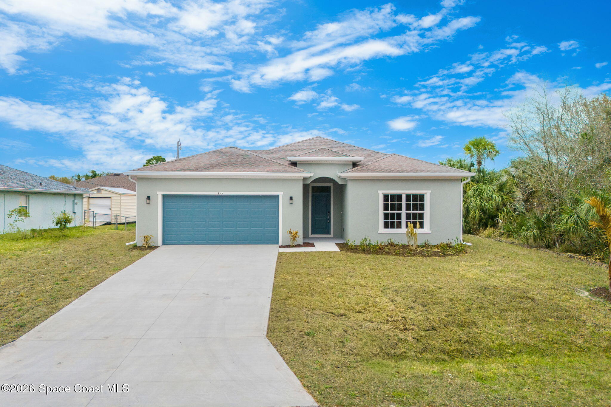 455 Mimosa Street Southwest Palm Bay, FL 32908 - Photo 42 of 43 a front view of a house with a garden and yard