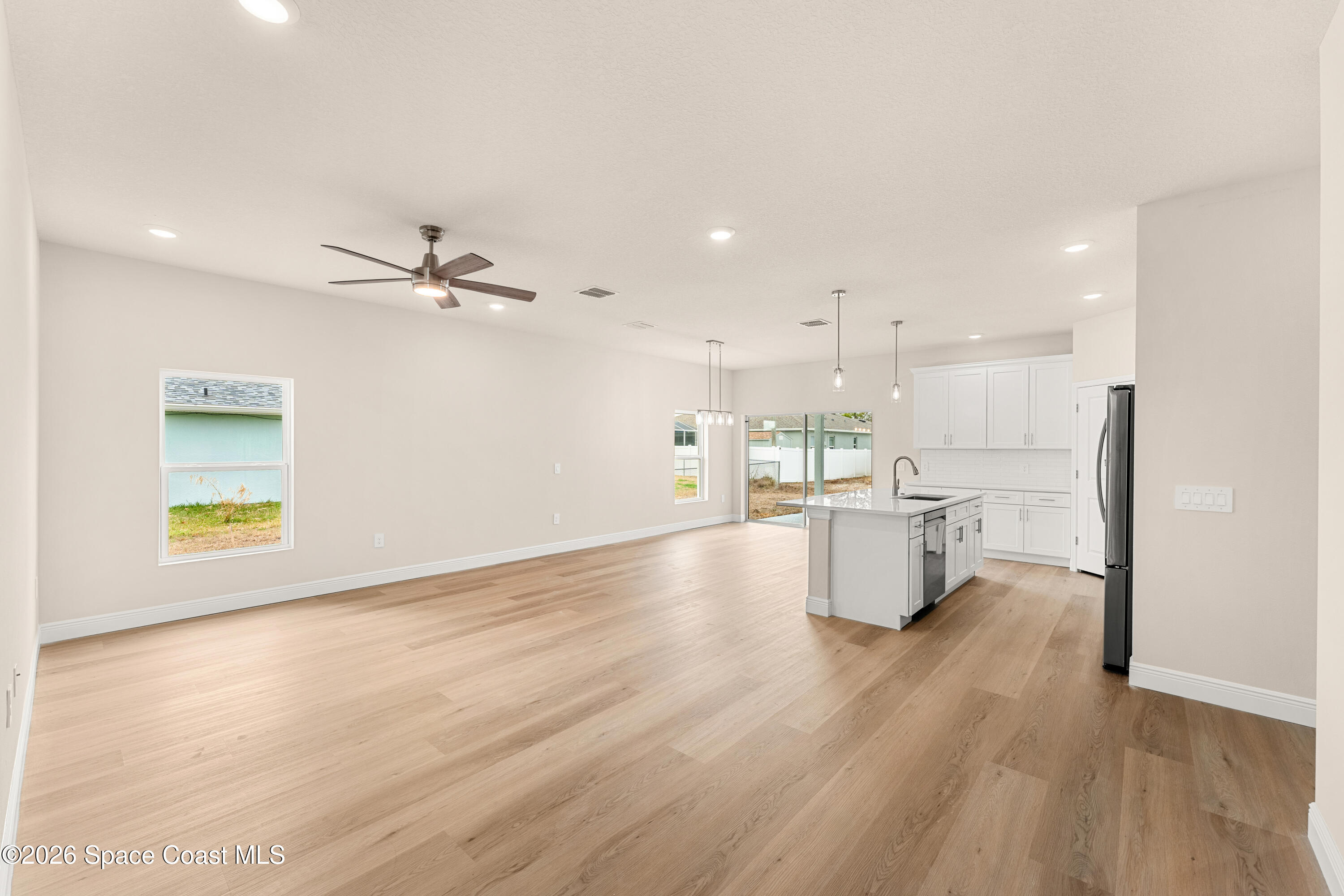 455 Mimosa Street Southwest Palm Bay, FL 32908 - Photo 8 of 43 a view of kitchen and windows