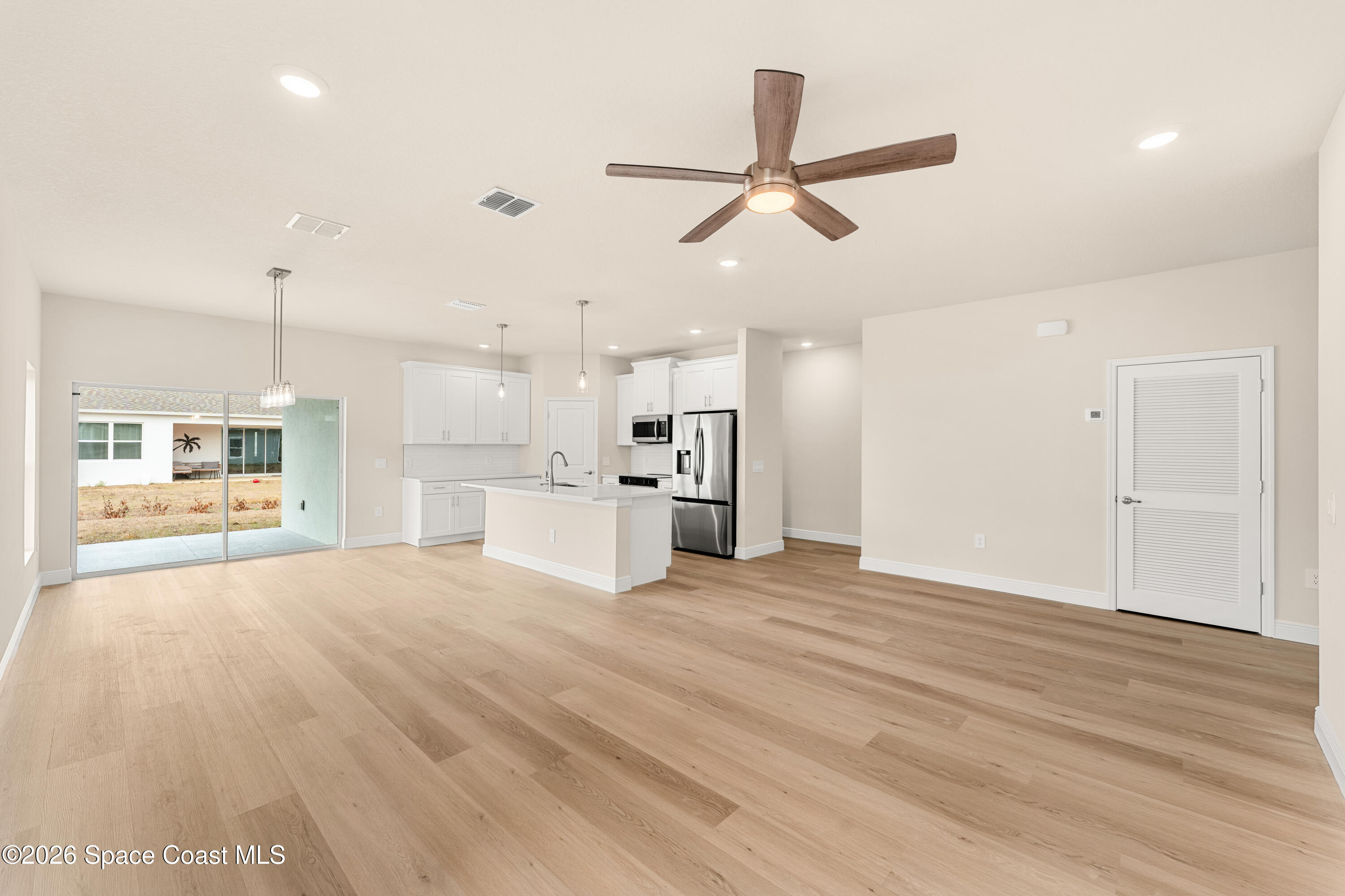 455 Mimosa Street Southwest Palm Bay, FL 32908 - Photo 9 of 43 a view of a kitchen with a sink and a window
