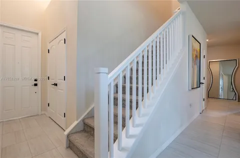 a view of a hallway with staircase