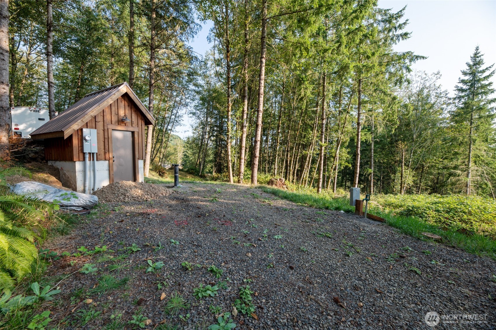189 Kjesbu Road Silver Creek, WA 98585 - Photo 6 of 17 a view of a house with a yard and large trees