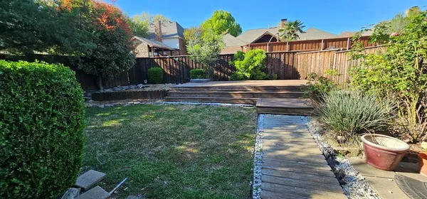 a view of a backyard with plants