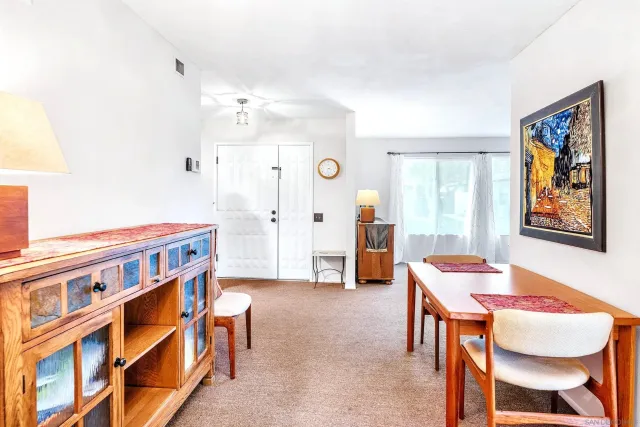 a dining room with a table and chairs